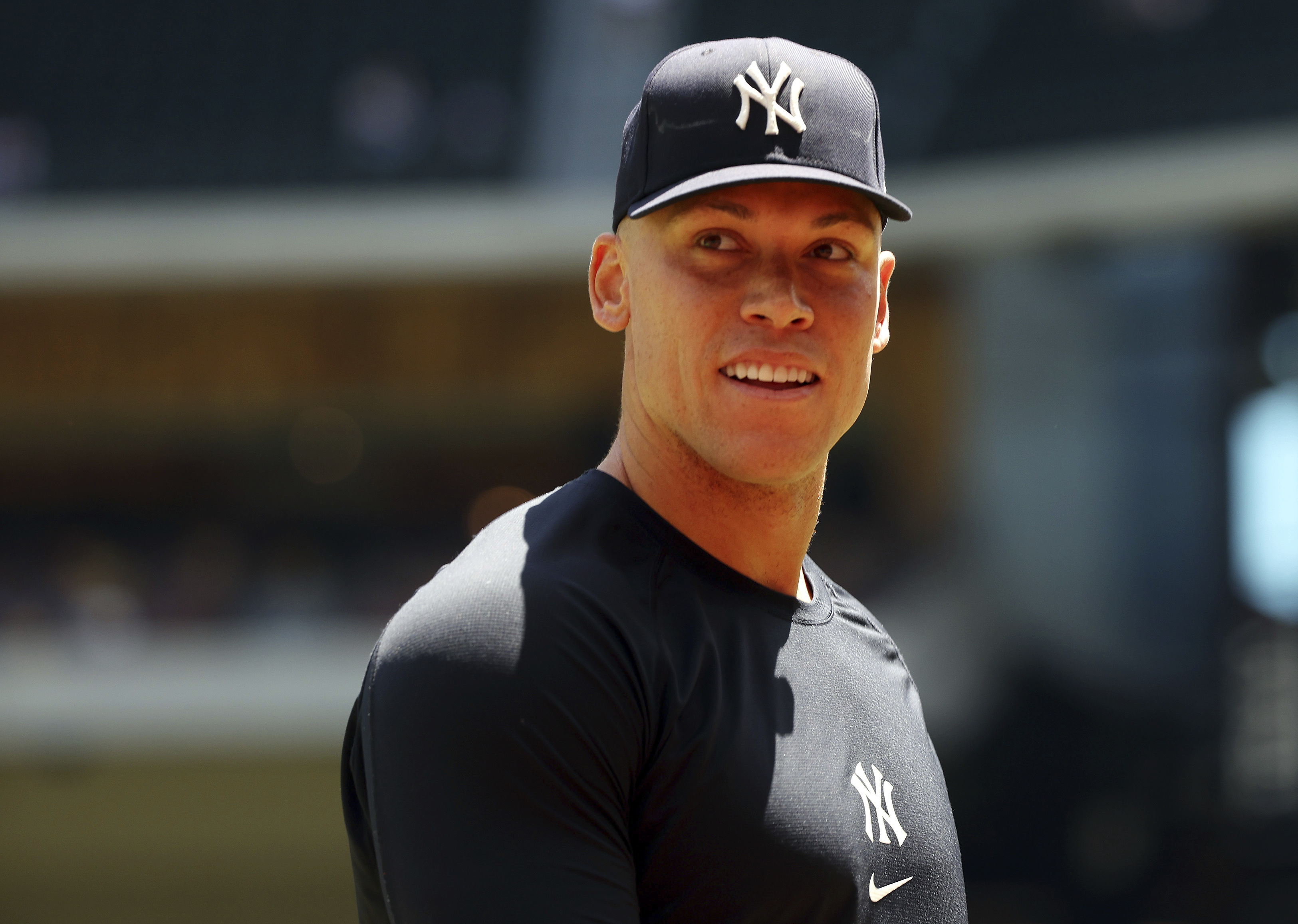 New York Yankees center fielder Aaron Judge (99) walks back to the dugout after taking a few warm up throws before a baseball game against the Texas Rangers on Sunday, April 30, 2023, in Arlington, Texas. 