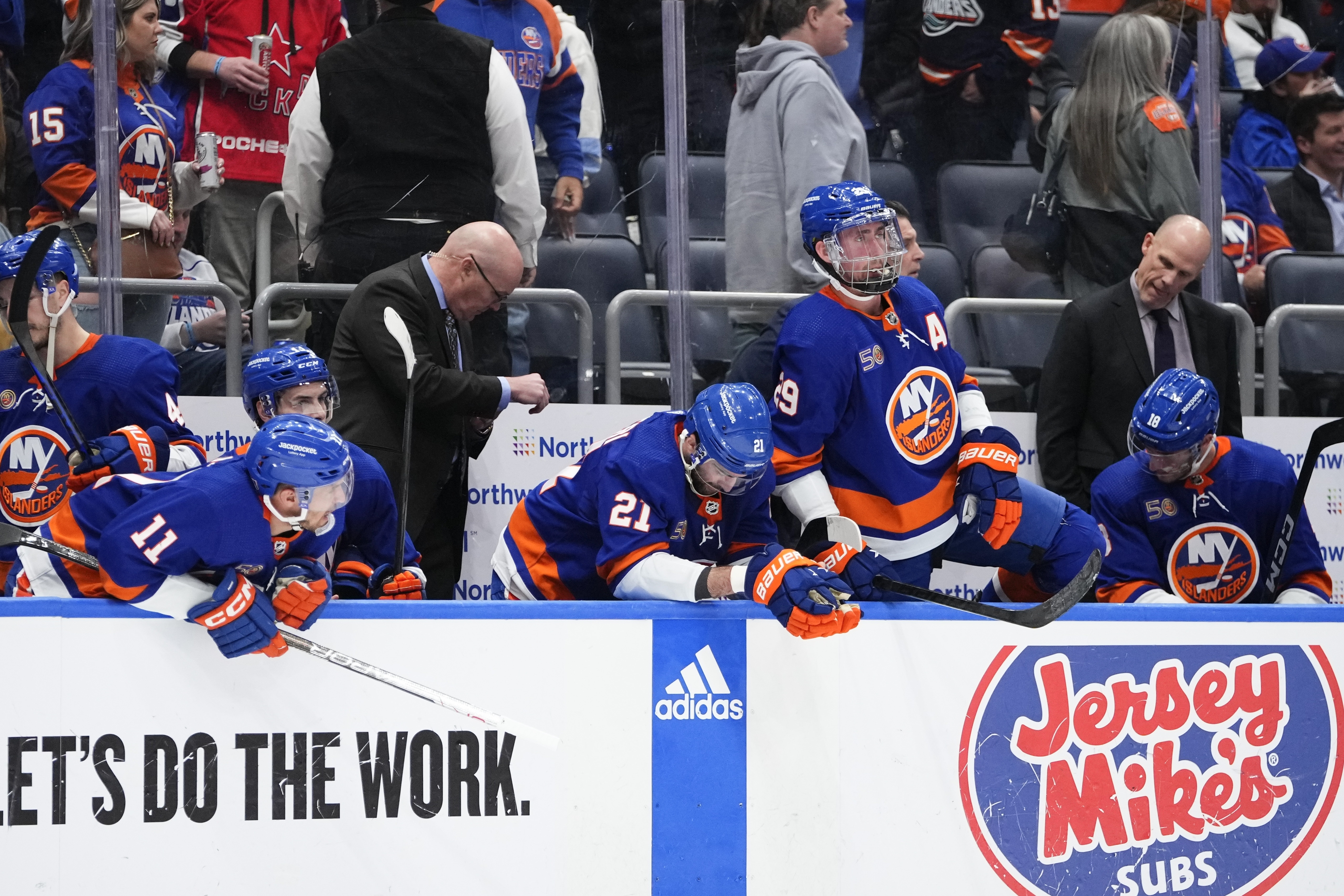 New York Islanders, including Zach Parise (11), Kyle Palmieri (21), and Brock Nelson (29), react to an overtime loss to the Carolina Hurricanes in Game 6 of an NHL hockey Stanley Cup first-round playoff series Friday, April 28, 2023, in Elmont, N.Y. The Hurricanes won 2-1, taking the series. 