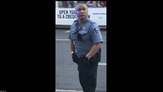 In this screen grab from video, former Minneapolis police officer Tou Thao appears at the scene where George Floyd died at the hands of former police officer Derek Chauvin, on May 25, 2020, in Minneapolis, Minn. Thao, who held back bystanders while his colleagues restrained a dying George Floyd, was found guilty on Monday of aiding and abetting manslaughter.