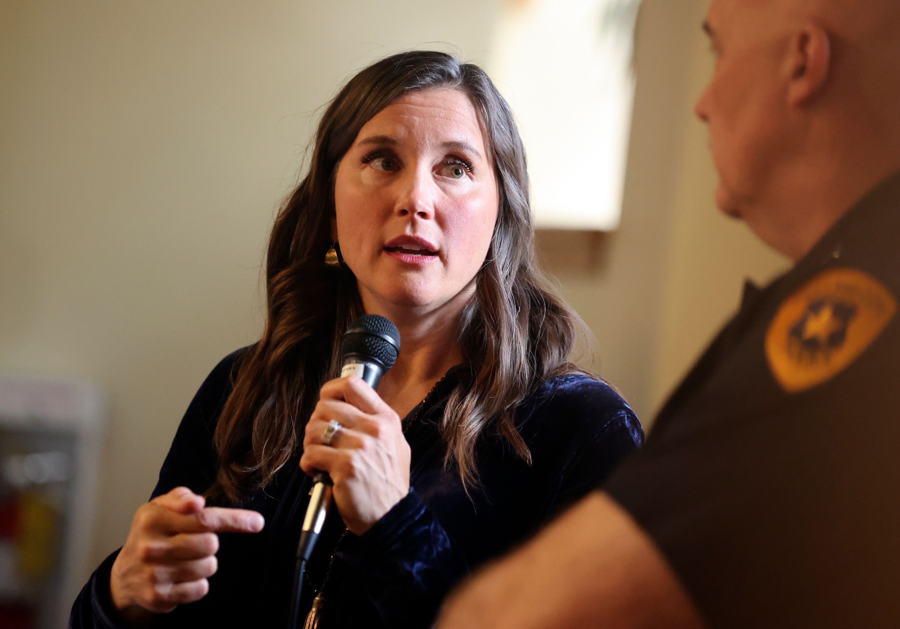 Salt Lake City Mayor Erin Mendenhall talks with Salt Lake City Police Chief Mike Brown at a District 5 Town Hall meeting in Salt Lake City on April 24. The mayor unveiled a $444.5 million budget proposal for the 2024 fiscal year on Tuesday.