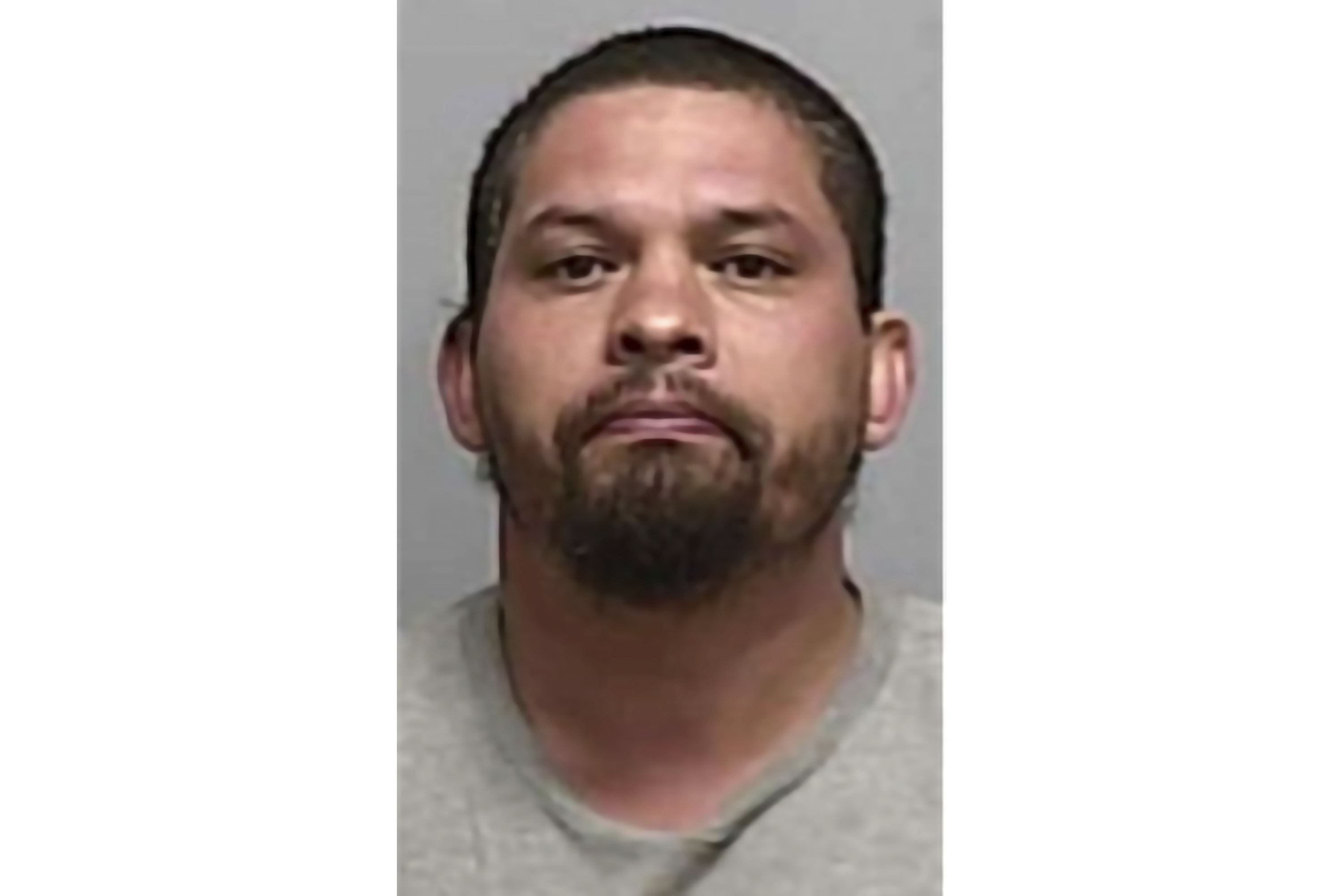Booking photo of Tony Ray Peralta on Tuesday. Authorities say Peralta, of Roswell, N.M., was arrested after calling 911, confessing to a 2008 murder case, and telling police where his former landlord's body was buried. 
