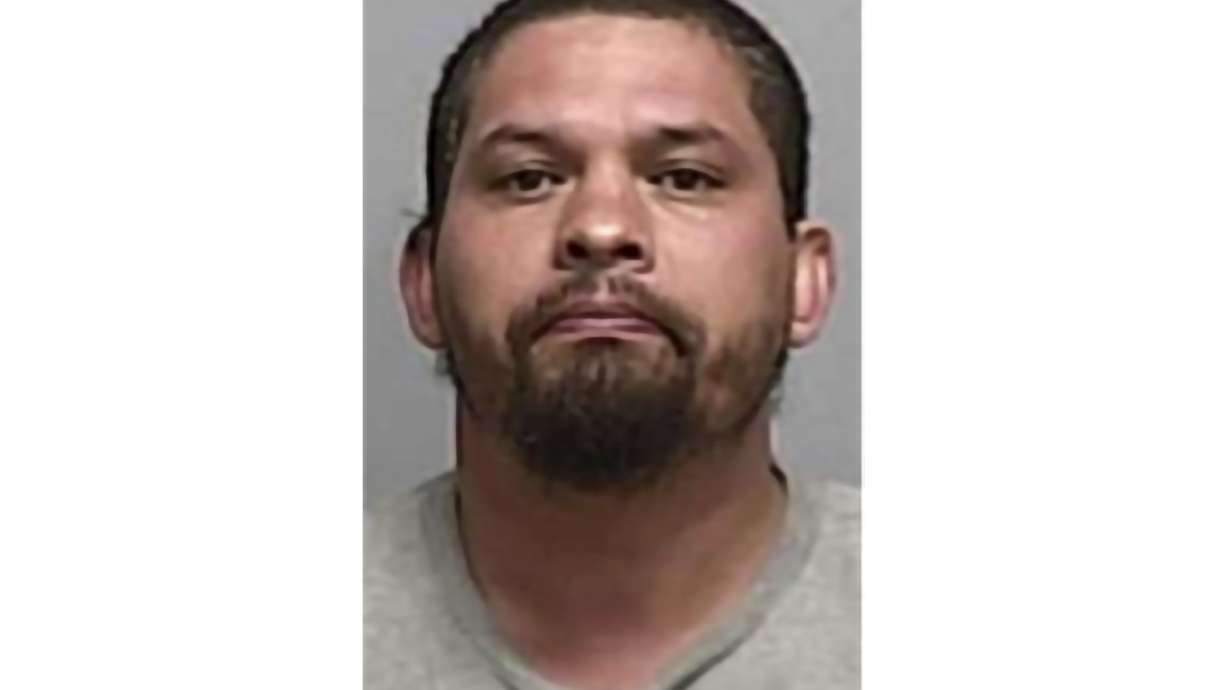 Booking photo of Tony Ray Peralta on Tuesday. Authorities say Peralta, of Roswell, N.M., was arrested after calling 911, confessing to a 2008 murder case, and telling police where his former landlord's body was buried.