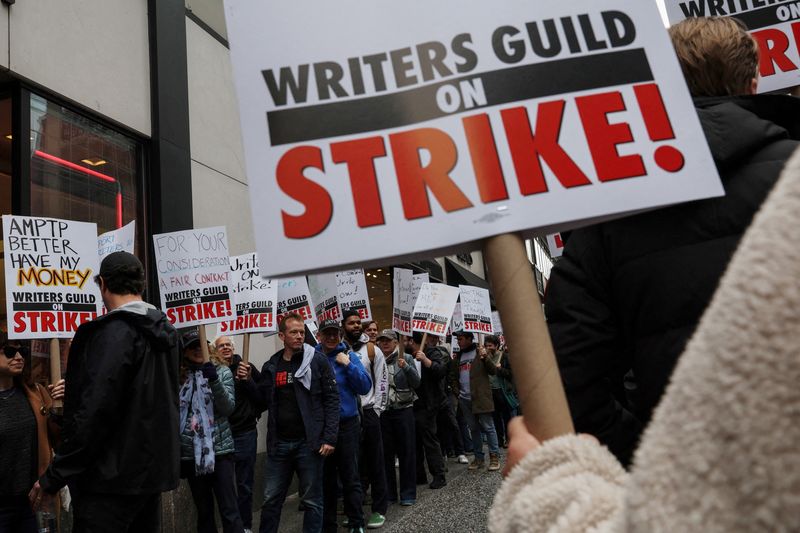 Members of the Writers Guild of America East picket outside Peacock Newfront streaming service offices, in New York City, Tuesday.