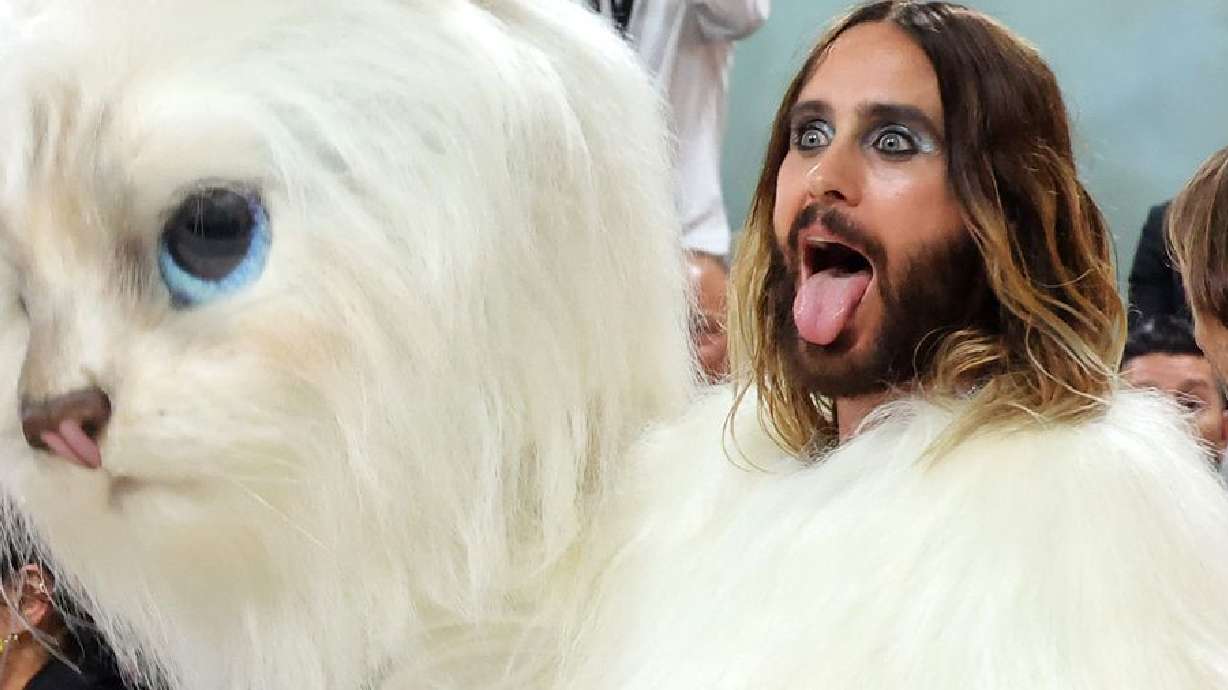 Jare Leto sticks his tongue out at the 2023 Met Gala on Monday, in his cat costume inspired by fashion designer Karl Lagerfeld's cat Choupette.