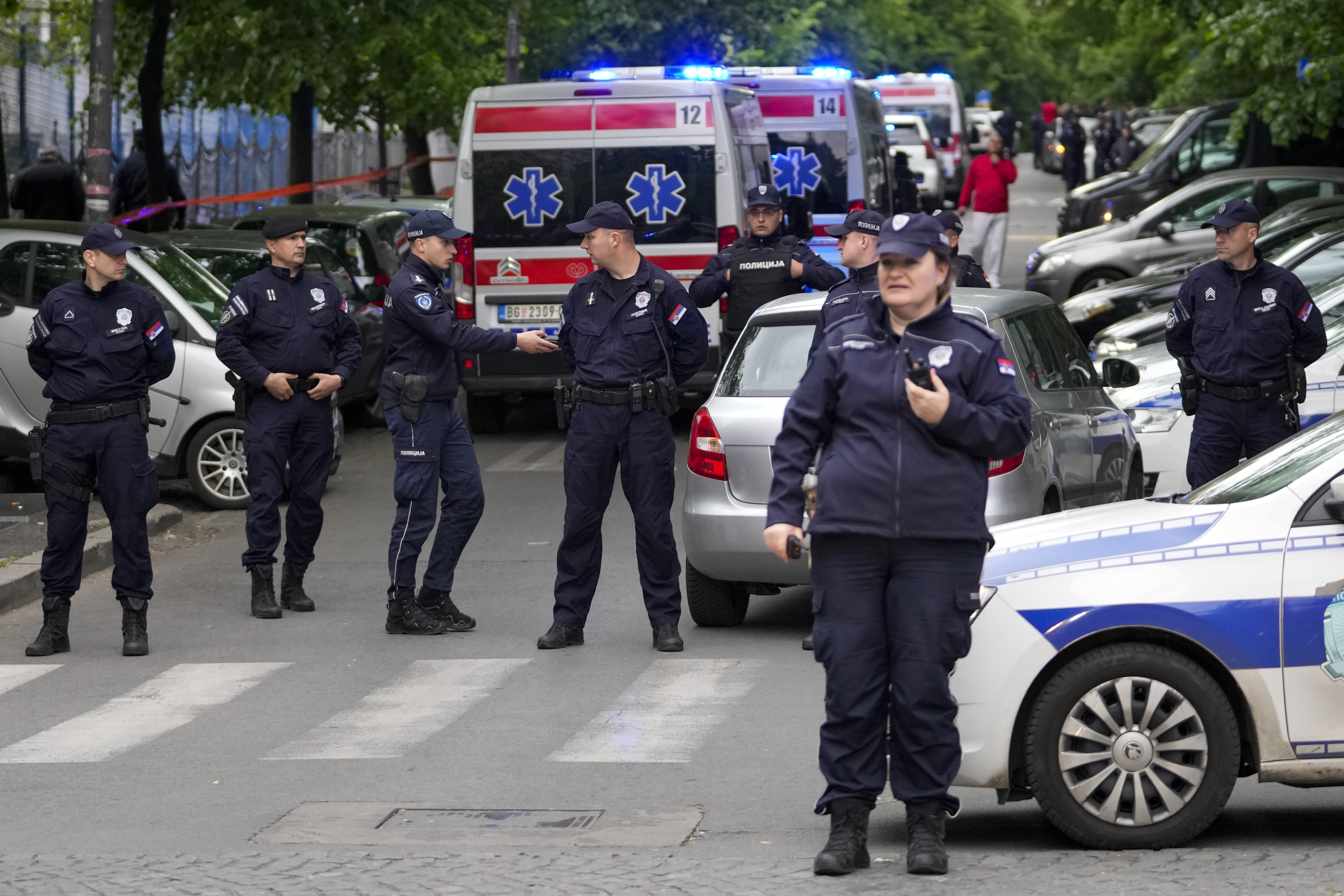 Police block streets around the Vladislav Ribnikar school in Belgrade, Serbia, Wednesday. A teenage boy opened fire early Wednesday in a school in central Belgrade, causing injuries. 