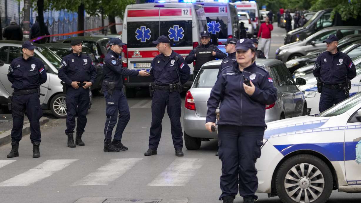 Police block streets around the Vladislav Ribnikar school in Belgrade, Serbia, Wednesday. A teenage boy opened fire early Wednesday in a school in central Belgrade, causing injuries.