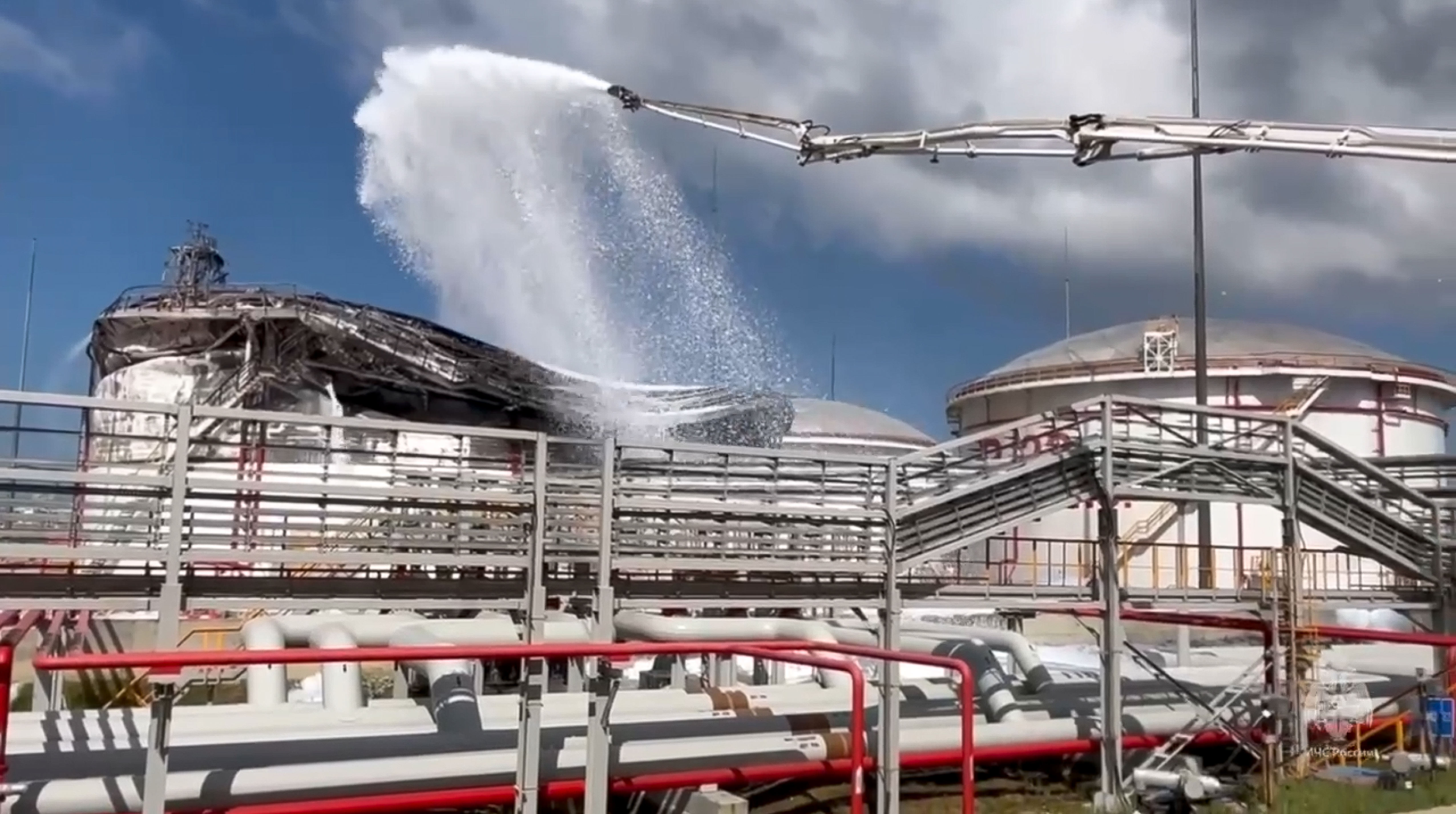 Firefighters work at the side of an oil depot near Taqman in Krasnodar region, south of Russia, in a photo released Wednesday. Russia claims it foiled a Ukrainian assassination attempt using drones against President Vladimir Putin.