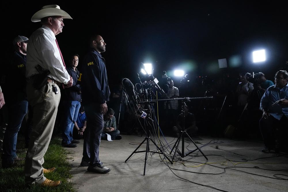 San Jacinto County Sheriff Greg Capers, left, and FBI assistant Special Agent in Charge Jimmy Paul speak to the media during a news conference announcing the arrest of murder suspect Francisco Oropeza on Tuesday in Cleveland, Texas. ss shooting that left five dead.