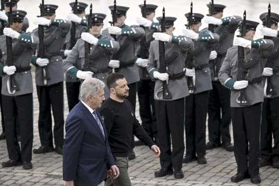 Ukrainian President Volodymyr Zelenskyy, right, and Finnish President Sauli Niinisto, review the honor guard at the Presidential Palace in Helsinki, Finland, Wednesday. Zelenskyy made an unannounced visit to the Finnish capital, Helsinki, for a one-day summit with Nordic leaders, as he pushes Ukraine’s Western allies to provide Kyiv with more military support.