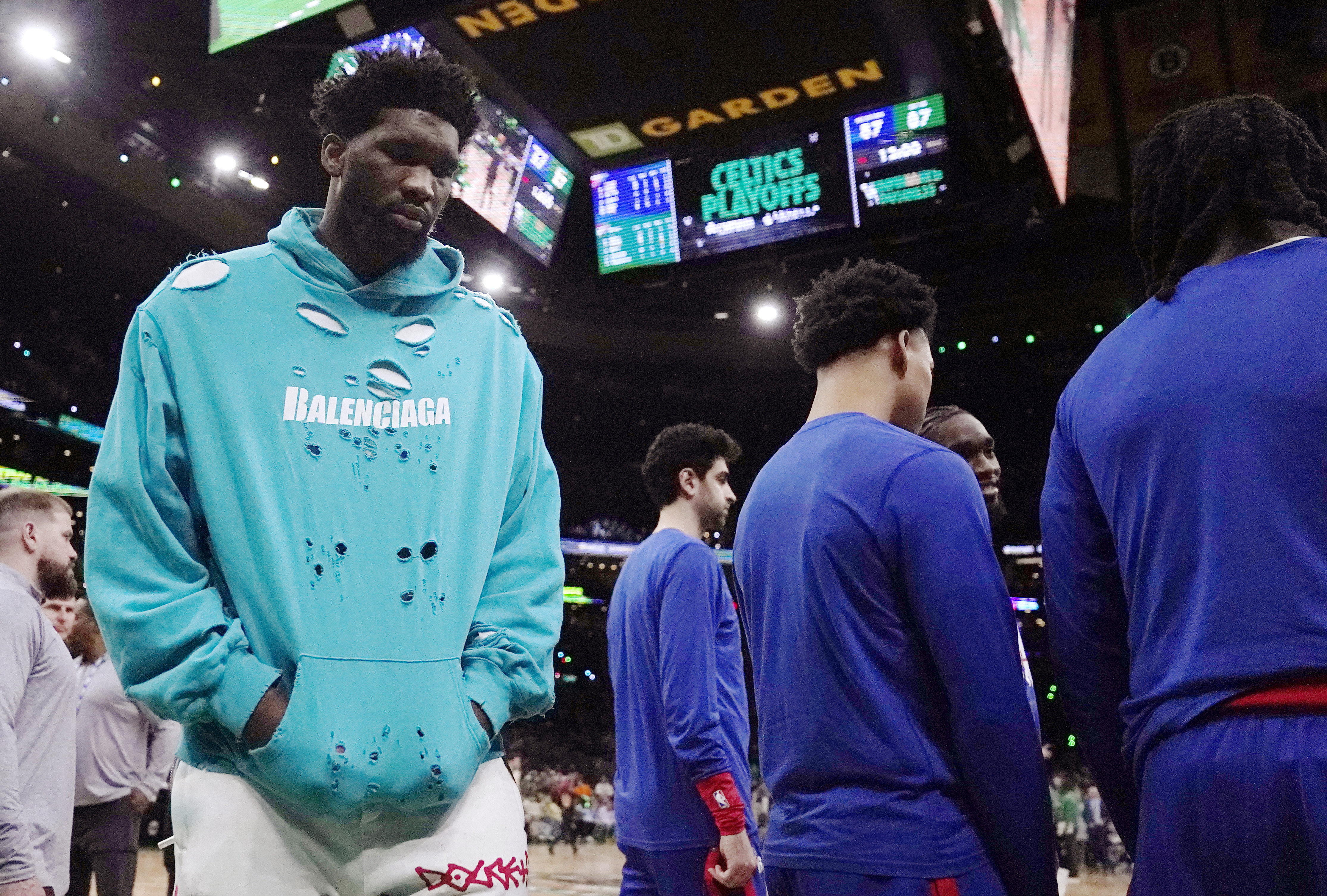 Philadelphia 76ers center Joel Embiid, left, walks on the court during the beginning of the second half of Game 1 against the Boston Celtics in the NBA basketball Eastern Conference semifinals playoff series, Monday, May 1, 2023, in Boston.