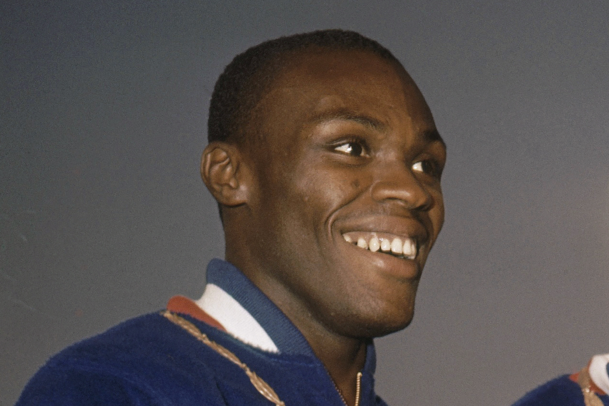 FILE - Ralph Boston smiles on the podium at the Summer Olympics in Rome, Italy, Sept. 2, 1960. Ralph Boston, the Olympic long jump champion who broke Jesse Owens' record then later had his own mark eclipsed by Bob Beamon's record-shattering leap at the Mexico City Games, has died. He was 83. The U.S. Olympic and Paralympic Committee confirmed Boston died Sunday, April 30, 2023, at his home outside of Atlanta.