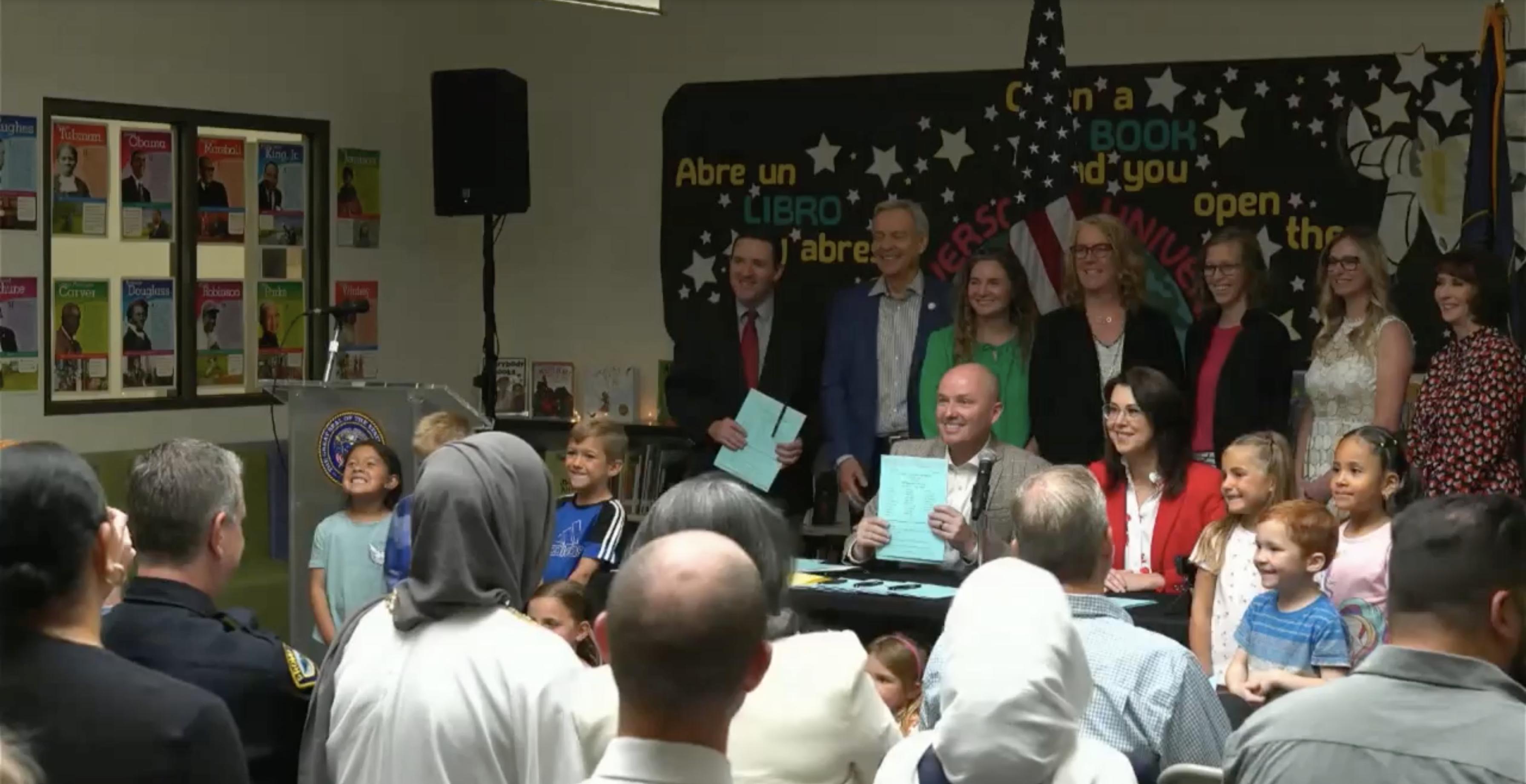 Gov. Spencer Cox and Lt. Gov. Deidre Henderson during a ceremonial bill signing Wednesday at Daniels Canyon Elementary in Heber City. Cox traveled to the school to sign eight different bills focused on education.