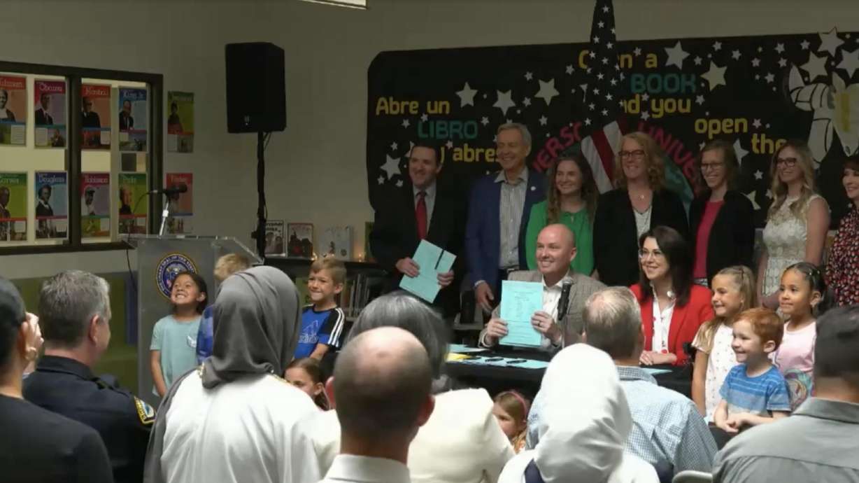 Gov. Spencer Cox and Lt. Gov. Deidre Henderson during a ceremonial bill signing Wednesday at Daniels Canyon Elementary in Heber City. Cox traveled to the school to sign eight different bills focused on education.