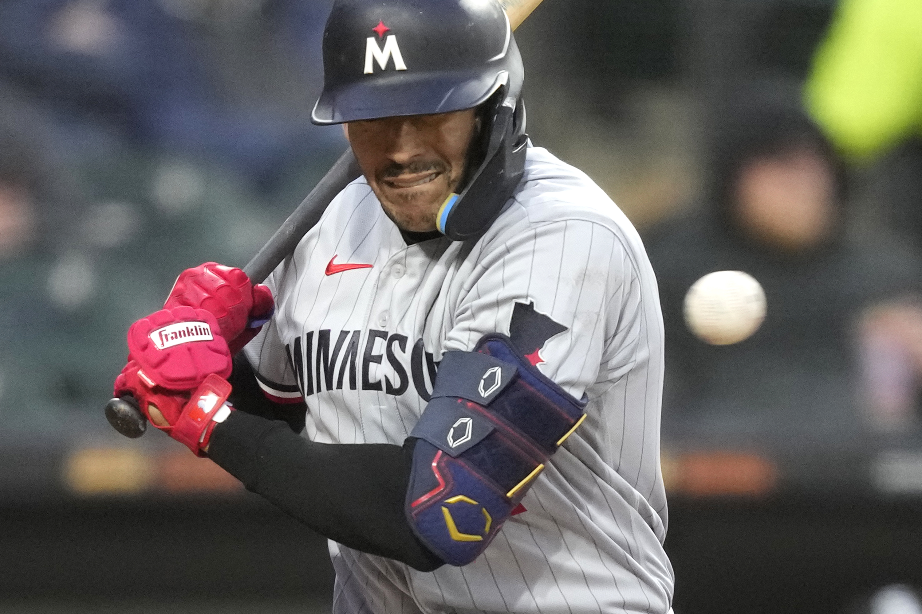 Minnesota Twins' Carlos Correa reacts to an inside pitch from Chicago White Sox's Michael Kopech during the sixth inning of a baseball game on Tuesday, May 2, 2023, in Chicago. 