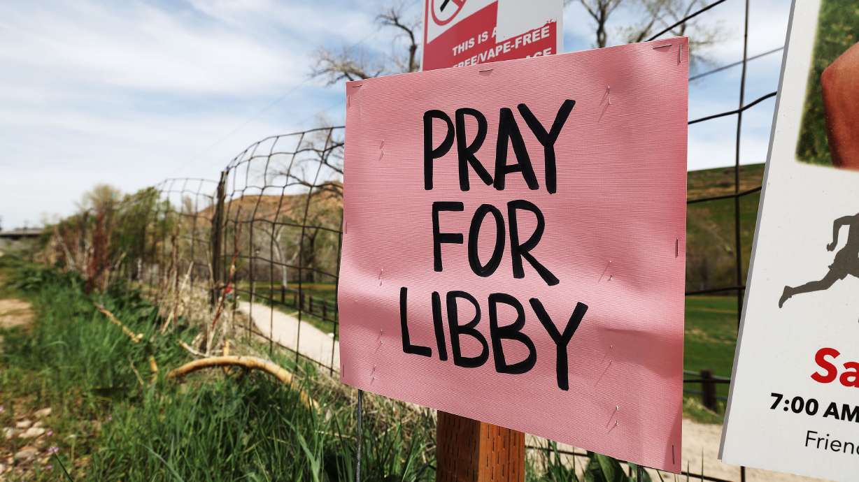 A sign hangs by the Weber River on Wednesday. Officials believe a woman fell in the river near Uintah, Weber County, on Monday.