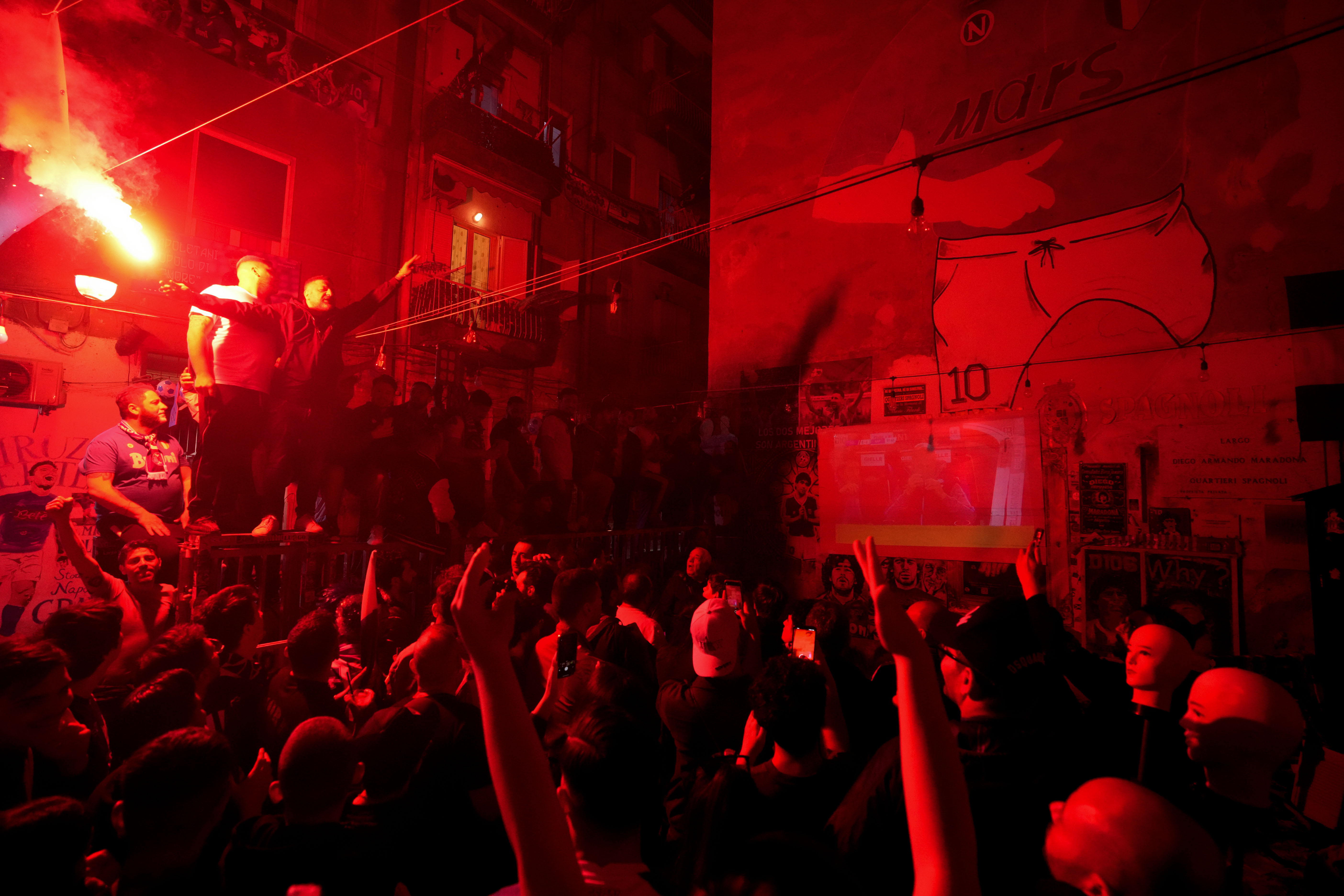Napoli fans celebrates on the street prior to the start of Udinese Napoli Serie A soccer match, in Naples, Italy, Thursday, May 4, 2023. For the third time in five days, Napoli fans are hoping and preparing to celebrate the Italian league soccer title. 