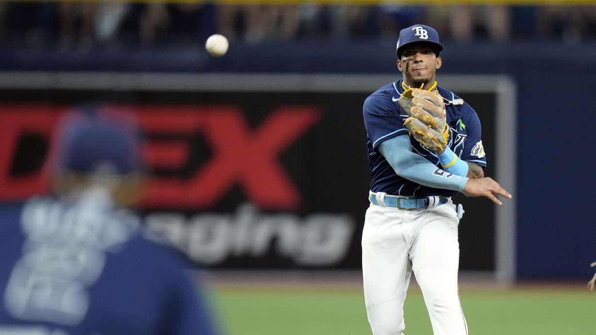 Tampa Bay Rays shortstop Wander Franco throws the ball to first baseman Yandy Diaz (2) to get Pittsburgh Pirates' Miguel Andujar out during the fourth inning of a baseball game Wednesday, May 3, 2023, in St. Petersburg, Fla.