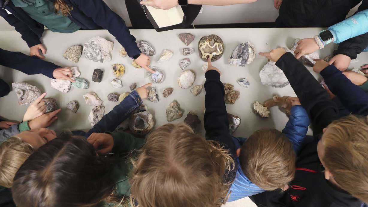 J.E. Cosgriff Memorial Catholic School students look over pieces of quartz on Oct. 9, 2019. By just one vote, the State School Board restored climate change to Utah's supplemental state standards for science and engineering education late Thursday.
