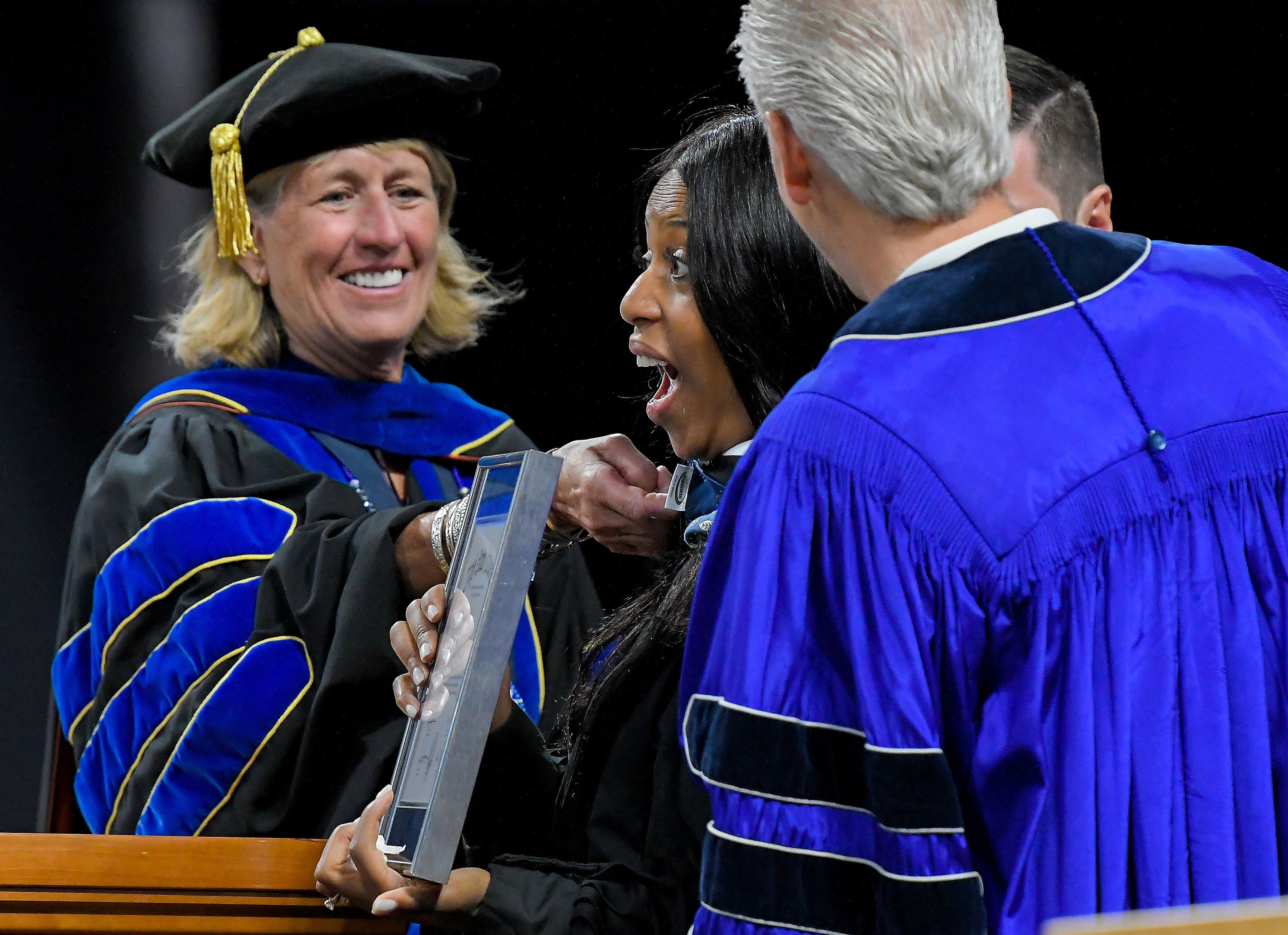 President Noelle Cockett, left, bestows an honorary degree of Humane Letters to Mia Love during Utah State University’s commencement ceremony on Thursday in Logan.