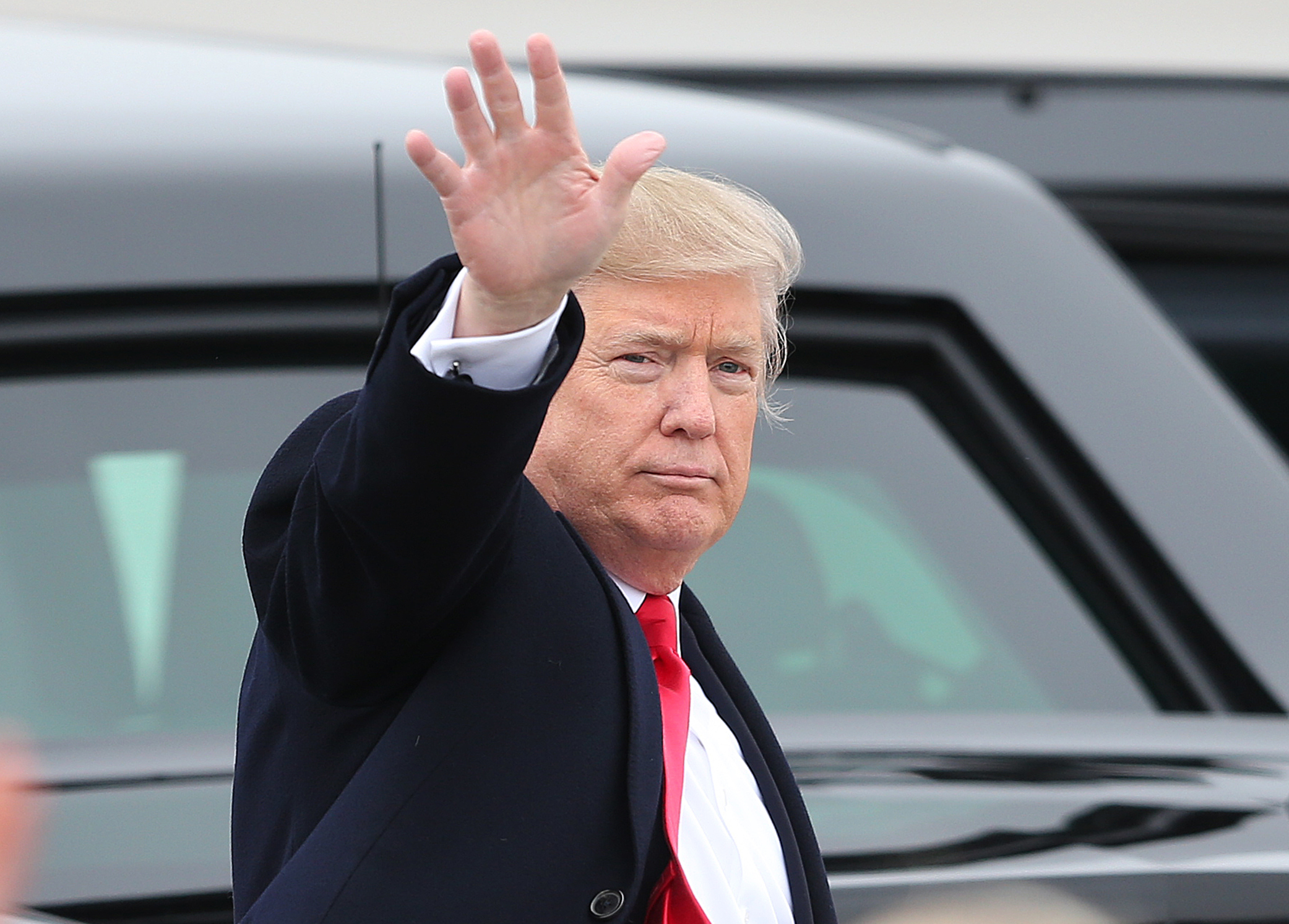President Donald Trump waves to the crowd at Roland R. Wright Air National Guard Base at the Salt Lake City International Airport  in Salt Lake City on Dec. 4, 2017.