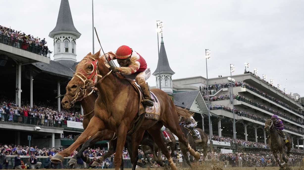 FILE - Rich Strike, with Sonny Leon aboard, crosses the finish line to win the 148th running of the Kentucky Derby horse race at Churchill Downs Saturday, May 7, 2022, in Louisville, Ky. Rich Strike's stunning upset victory in last year's Kentucky Derby as a nearly 81-1 long shot provided the race's second biggest odds winner in four years.