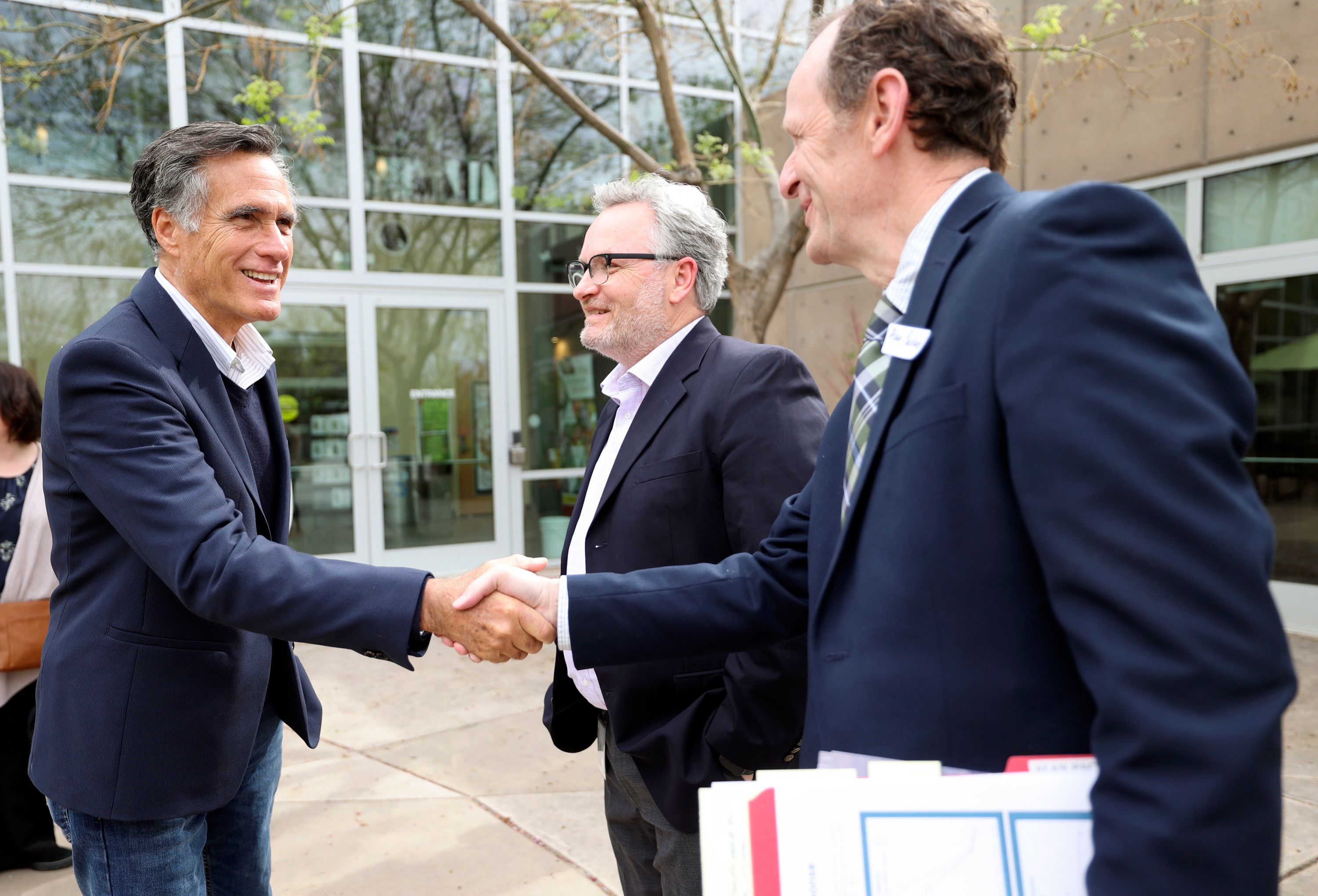 Sen. Mitt Romney, R-Utah, shakes hands with Alan Packard, Jordan Valley Water Conservancy District general manager, right, and Soren Simonsen, Jordan River Commission executive director, center, after a roundtable discussion about the Jordan River Watershed and the Great Salt Lake at the Jordan Valley Water Conservancy District in West Jordan on Friday.
