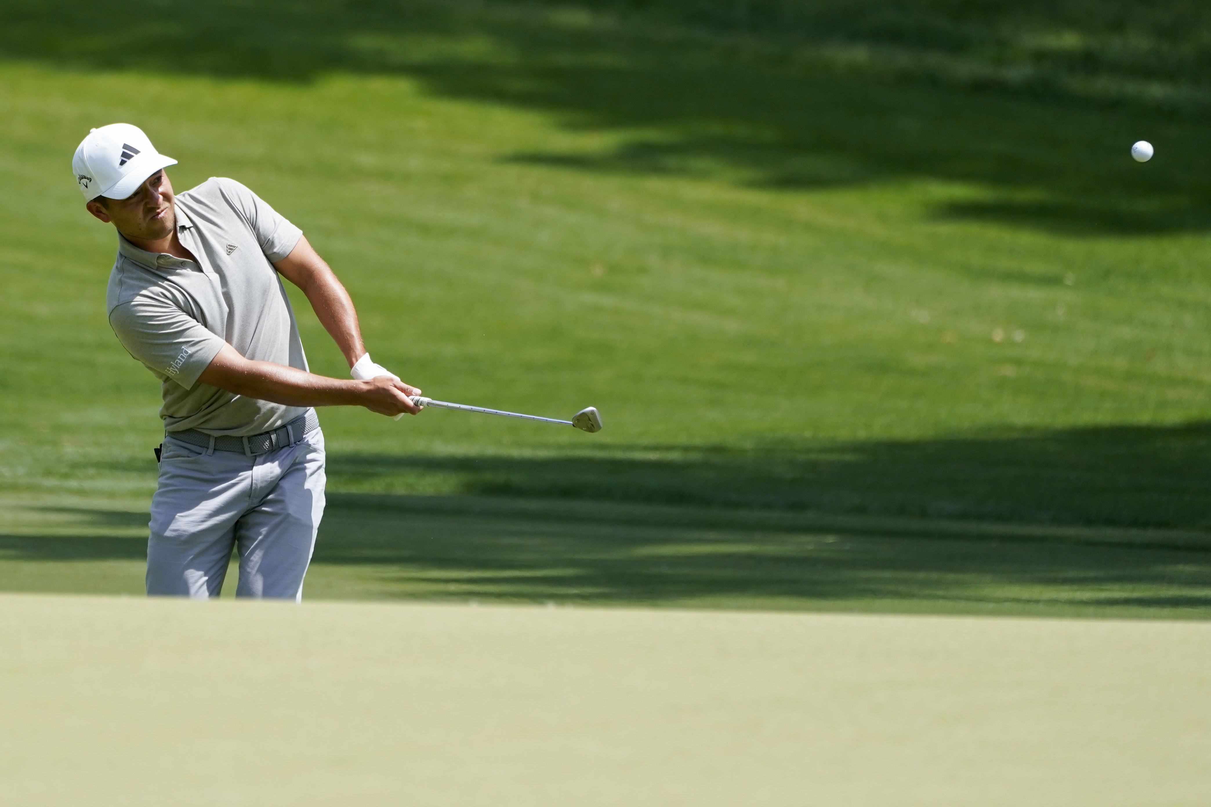 Wyndham Clark hits to the green on the sixth hole during third round of the Wells Fargo Championship golf tournament at the Quail Hollow Club on Saturday, May 6, 2023, in Charlotte, N.C. 