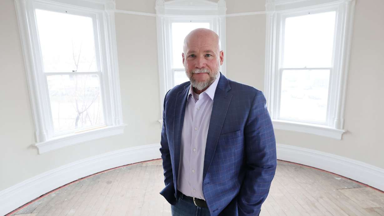 Dave Durocher, executive director of The Other Side Academy, poses in the Armstrong Mansion on the academy's campus in Salt Lake City on March 29. The organization works with former prisoners hoping to rehabilitate their lives.