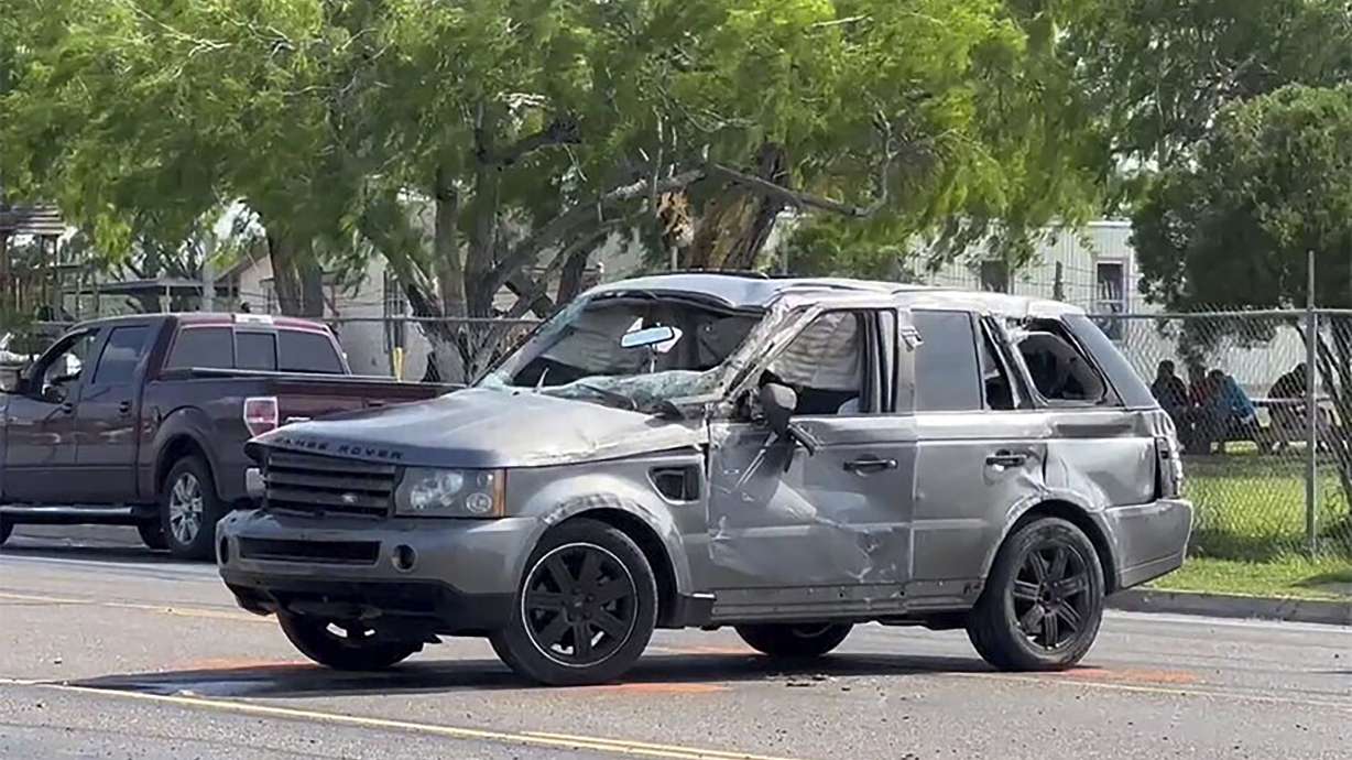 A damaged vehicle sits at the site of a deadly collision near a bus stop in Brownsville, Texas, on Sunday.