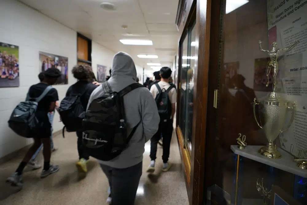 Students walk through Upper Darby High School, April 12, in Drexel Hill, Pa. For some schools, the pandemic allowed experimentation to try new schedules. Large school systems including Denver, Philadelphia and Anchorage, Alaska, have been looking into later start times.