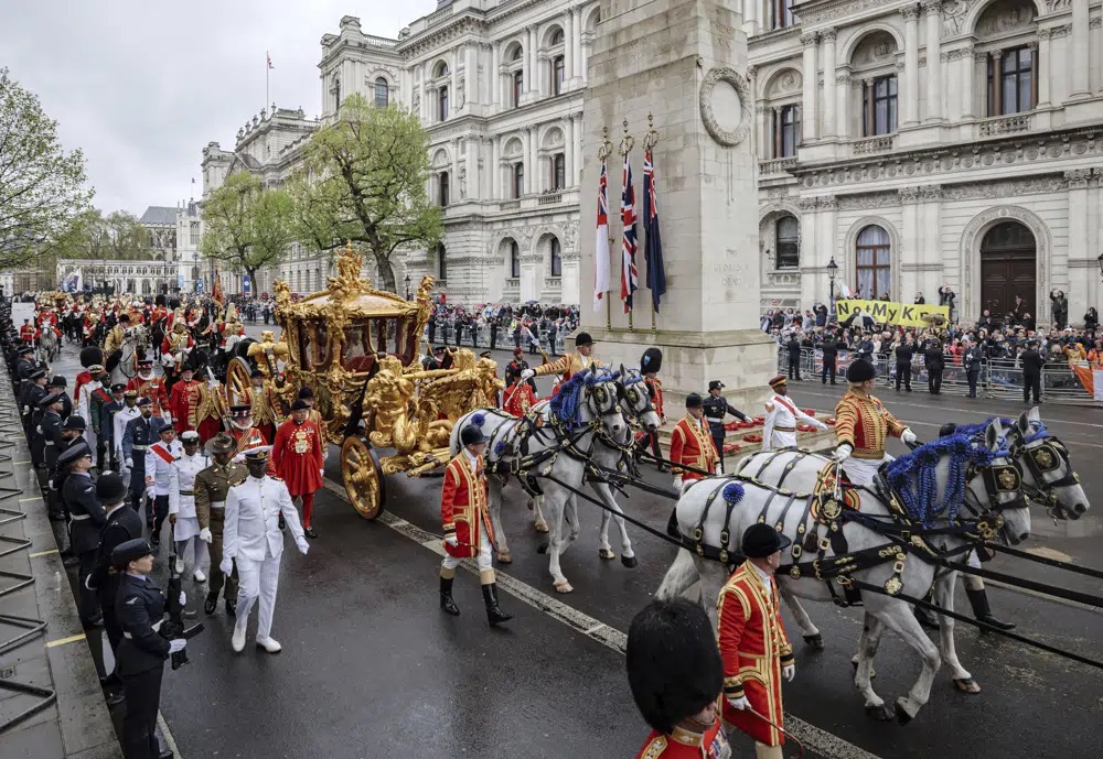 Britain's King Charles III and Queen Camilla travel to Buckingham Palace in the Gold State Coach after their coronation ceremony in Westminster Abbey, London, on Saturday.