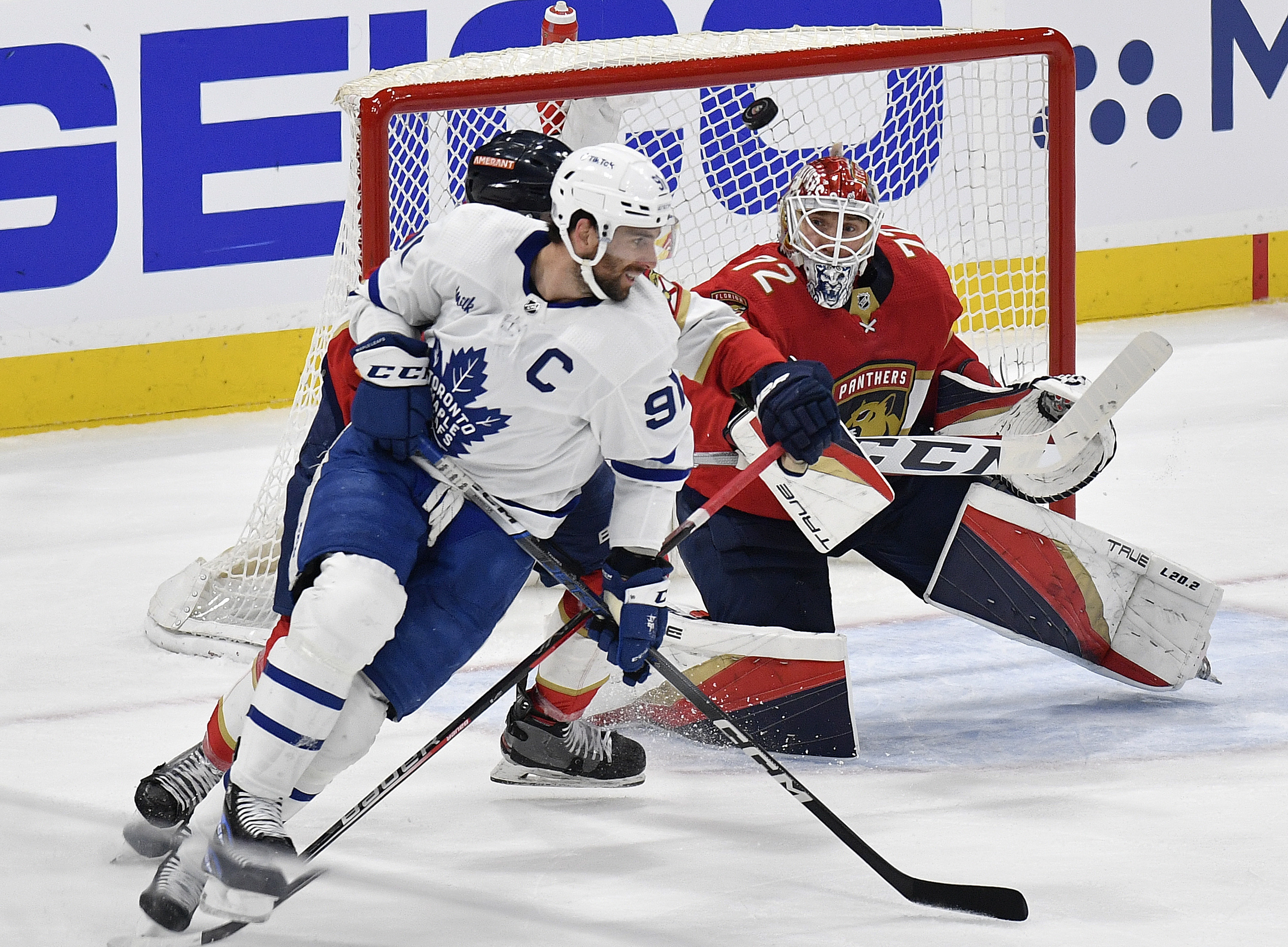 Florida Panthers goaltender Sergei Bobrovsky (72) stops the puck in front of Toronto Maple Leafs center John Tavares (91) during the second period of Game 3 of an NHL hockey Stanley Cup second-round playoff series, Sunday, May 7, 2023, in Sunrise, Fla. 