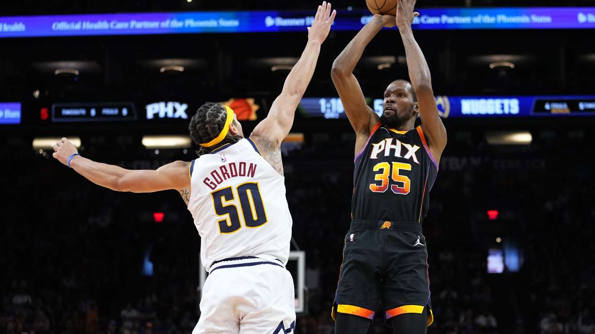 Phoenix Suns forward Kevin Durant (35) shoots over Denver Nuggets forward Aaron Gordon (50) during the first half of Game 4 of an NBA basketball Western Conference semifinal game, Sunday, May 7, 2023, in Phoenix.