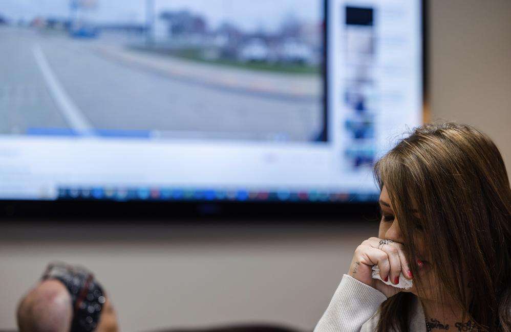 Marsha Quintana wipes away tears as a body camera video showing her son being tackled and punched by Ogden police officers is played. Quintana and her son, Shawn Sims, along with their attorney Robert Sykes held a press conference on Monday to announce the filing of a federal civil lawsuit against the police department and the city of Ogden.