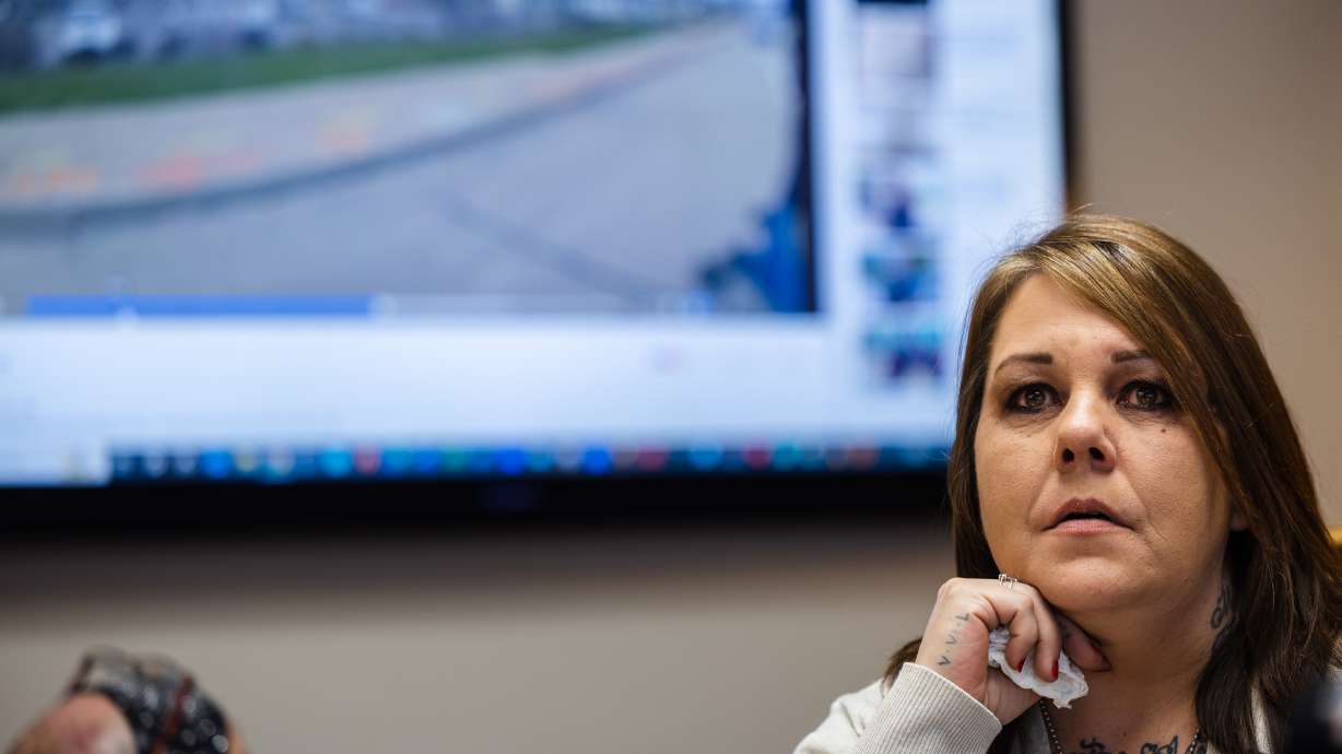 Marsha Quintana, the mother of Shawn Sims, looks away as police body camera footage of her son’s arrest plays during a press conference at the Sykes McAllister Law Offices in Salt Lake City on Monday.