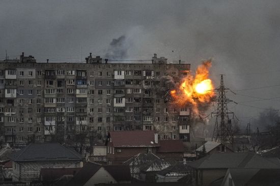 An explosion erupts from an apartment building at 110 Mytropolytska Street, after a Russian army tank fired on it in Mariupol, Ukraine, March 11, 2022. The image was part of a series of images by Associated Press photographers that was awarded the 2023 Pulitzer Prize for Breaking News Photography.