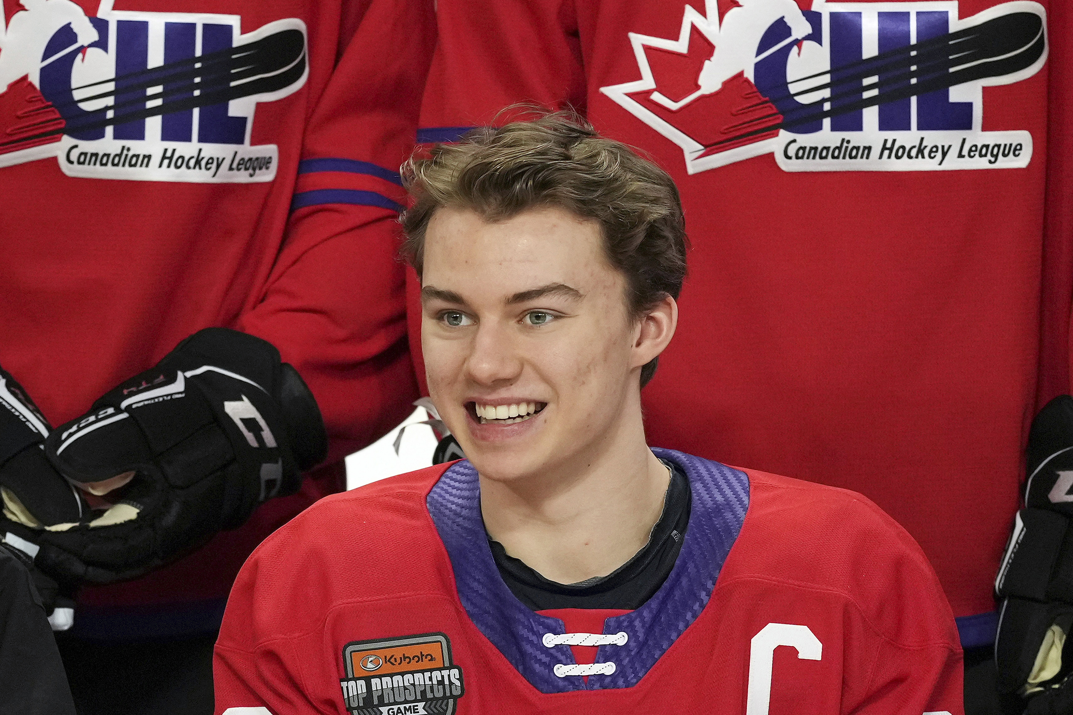 FILE - Regina Pats' Connor Bedard smiles for a team photo ahead of the CHL/NHL Top Prospects game, in Langley, British Columbia, Wednesday, Jan. 25, 2023. The NHL draft lottery is drawn, determining which team gets the chance to select Connor Bedard with the No. 1 pick. The Anaheim Ducks, Columbus Blue Jackets and Chicago Blackhawks have the highest odds of landing the most anticipated top pick since Connor McDavid in 2015. 