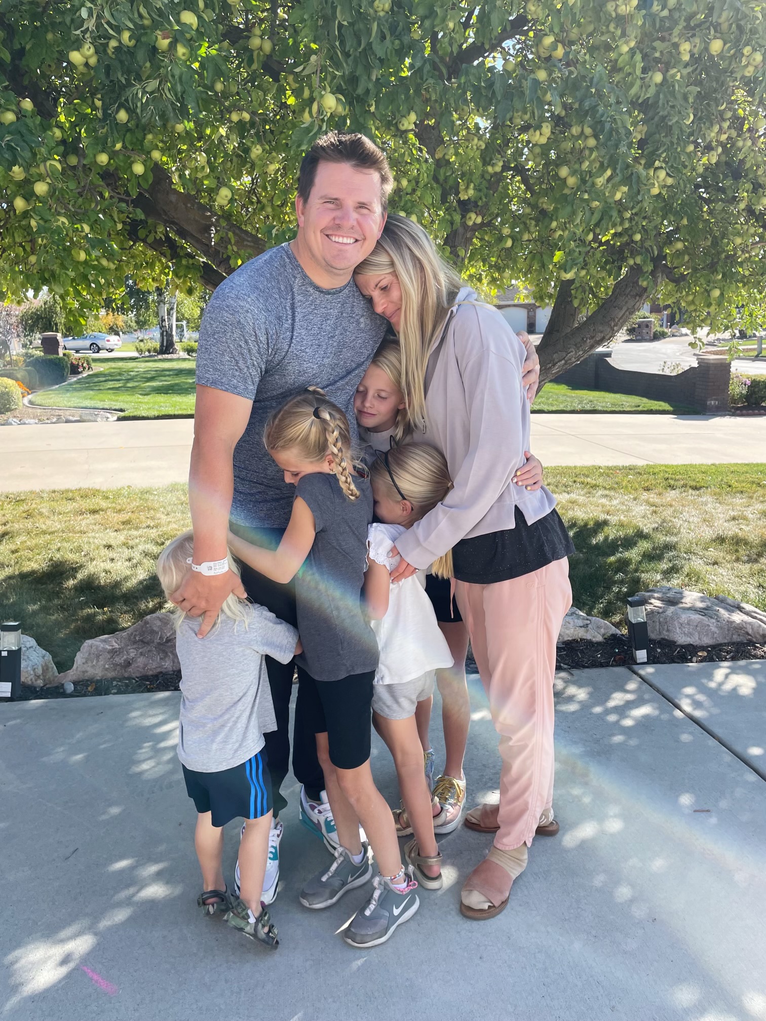 Brad and Melissa Coleman, of North Ogden, hug their children after he endured a stroke and resulting thrombectomy surgery to remove a clot in his brain at McKay-Dee Hospital in October 2022.