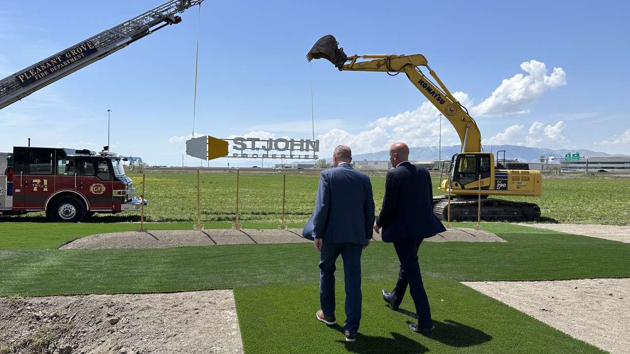 St. John Properties regional partner Daniel Thomas and Gov. Spencer Cox walk to the groundbreaking site for Valley Grove's sixth phase of development on Tuesday in Pleasant Grove.