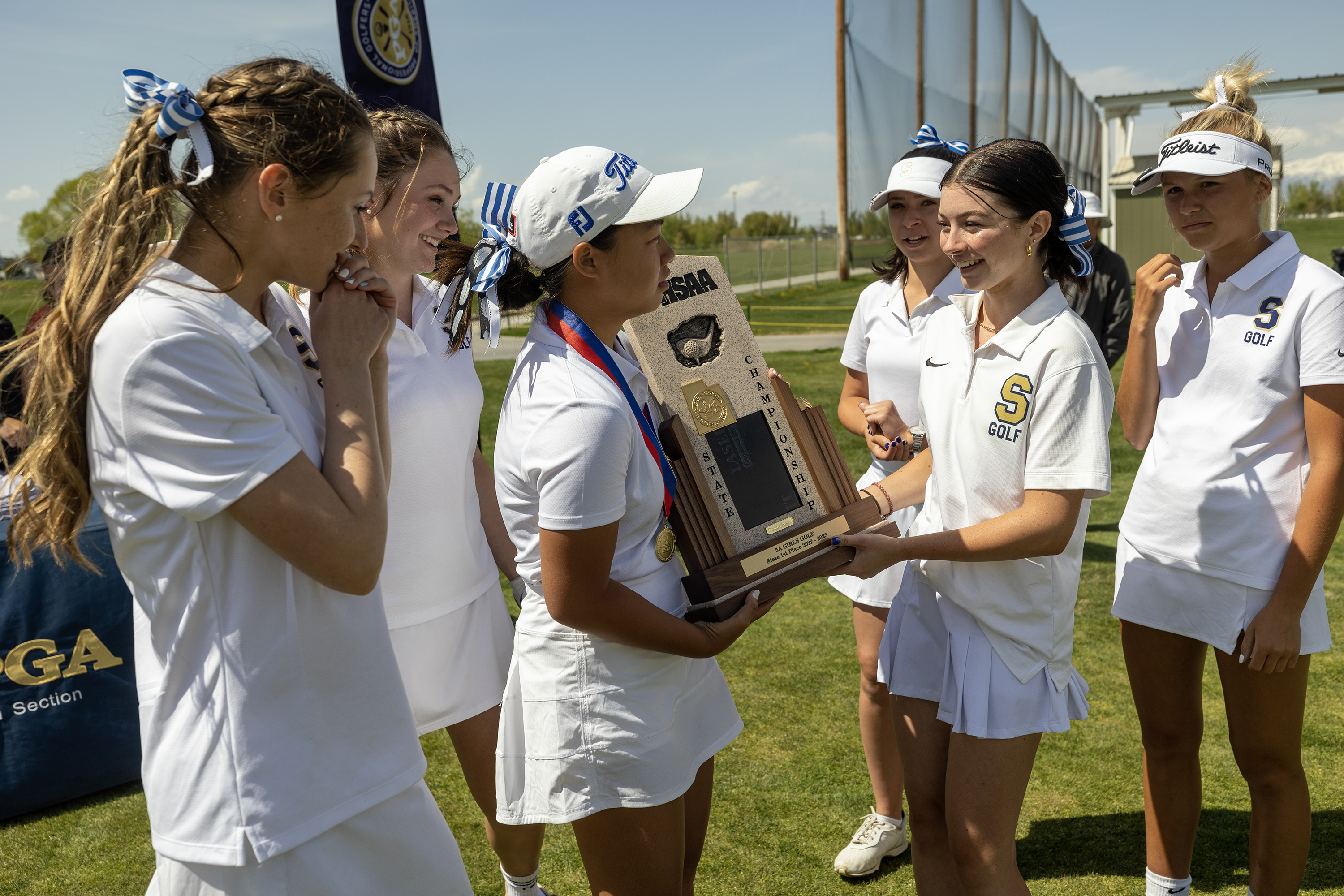 Skyline golfers with their championship trophy after taking the 5A High School State Championship at Remuda Golf Course in Ogden on Tuesday, May 9, 2023.