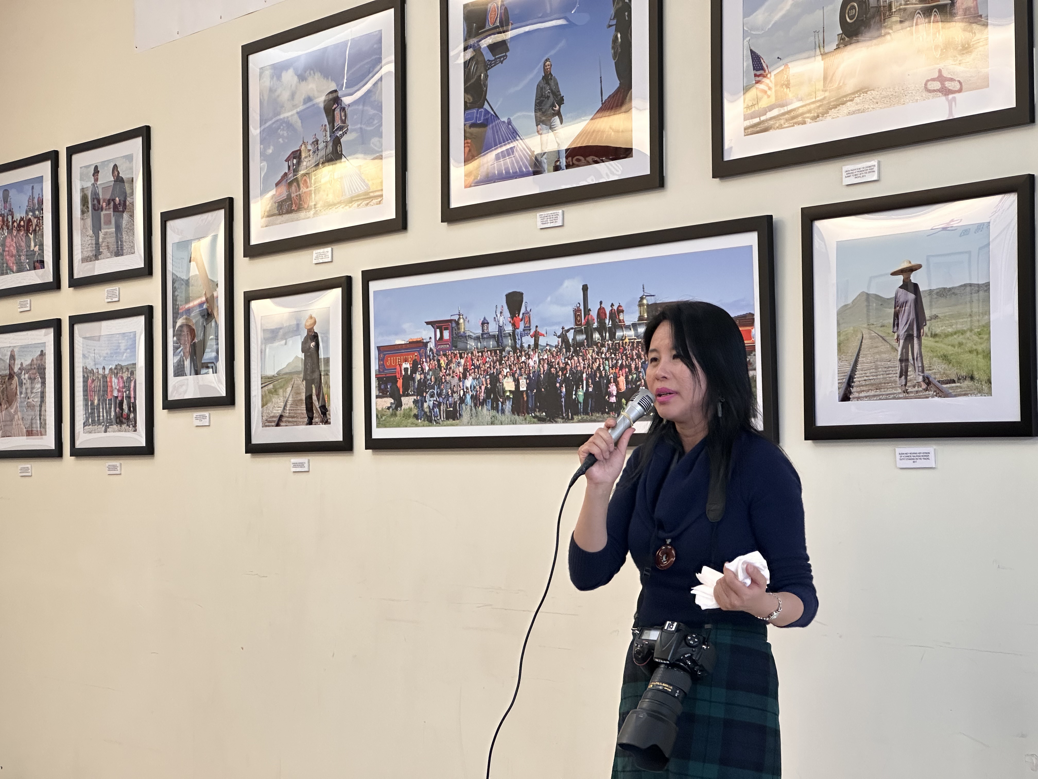 Karen Zhou speaks at the launch of her first solo exhibit, "Making History," in the Chinatown Supermarket in South Salt Lake on Tuesday.