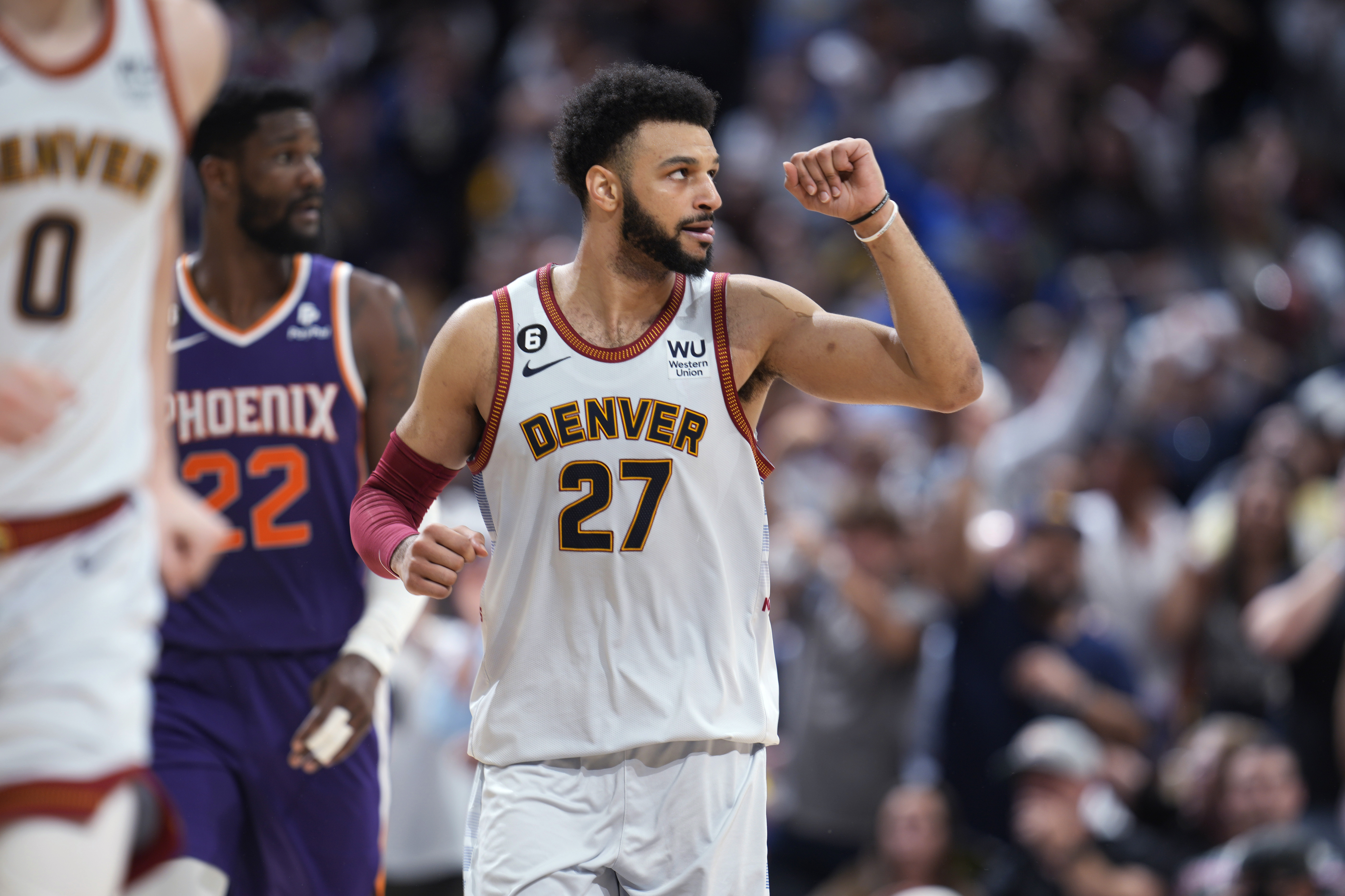 Denver Nuggets guard Jamal Murray gestures after hitting a 3-point basket against the Phoenix Suns during the second half of Game 5 of an NBA Western Conference basketball semifinal playoff series Tuesday, May 9, 2023, in Denver. 
