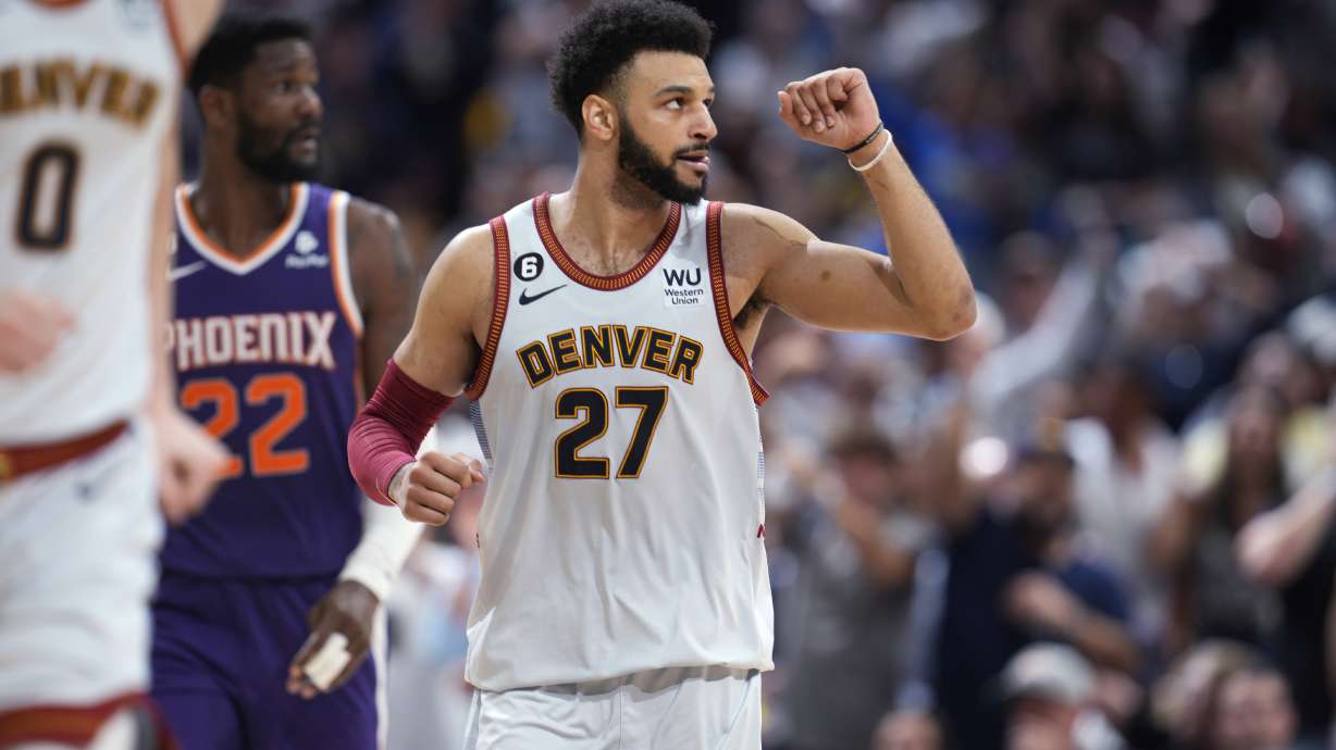 Denver Nuggets guard Jamal Murray gestures after hitting a 3-point basket against the Phoenix Suns during the second half of Game 5 of an NBA Western Conference basketball semifinal playoff series Tuesday, May 9, 2023, in Denver.