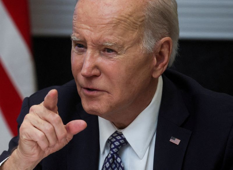 President Joe Biden speaks with members of his "Investing in America Cabinet" at the White House in Washington, Friday. The White House called on Congress to pass permitting legislation that would help speed up clean energy and fossil fuel projects.