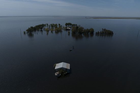 Farmland in the Tulare Lake Basin is submerged in water in Corcoran, Calif., April 20, after more than a dozen atmospheric rivers dumped record-setting rain and snowfall. Nearly half of the U.S. West has emerged from drought, but intense water challenges persist, scientists said Tuesday.