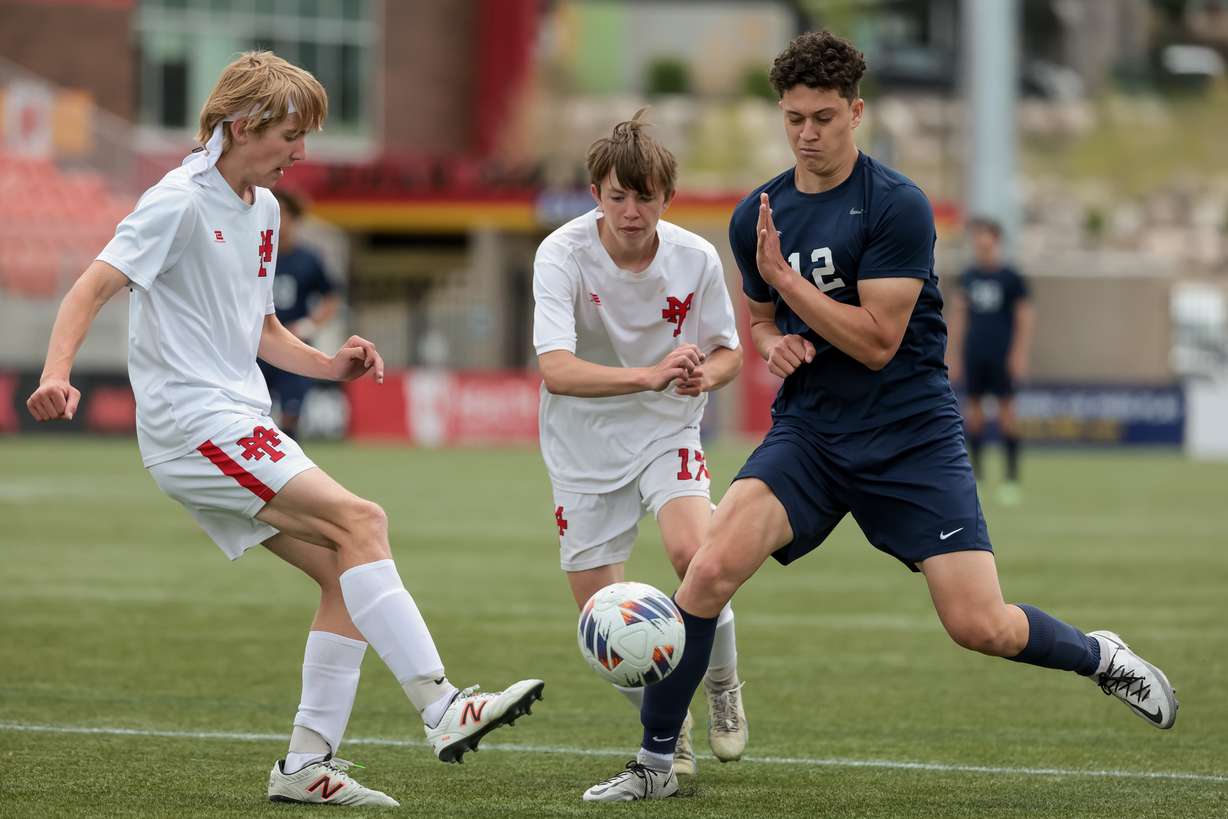 Manti’s Corbin Henry, left, kicks the ball past Juan Diego’s Vladimir Leontieff in a 3A boys soccer state semifinal at Zions Bank Stadium in Herriman on Wednesday, May 10, 2023.