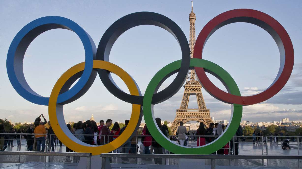 FILE - The Olympic rings are set up at Trocadero plaza that overlooks the Eiffel Tower, a day after the official announcement that the 2024 Summer Olympic Games will be in the French capital, in Paris, Thursday, Sept. 14, 2017. A new-round ticketing sale kicked off Thursday for Paris Olympics next year. Only the lucky winners of a lottery will be able to buy about 1.5 million seats for the most prestigious competitions, as well as the opening and closure ceremonies.