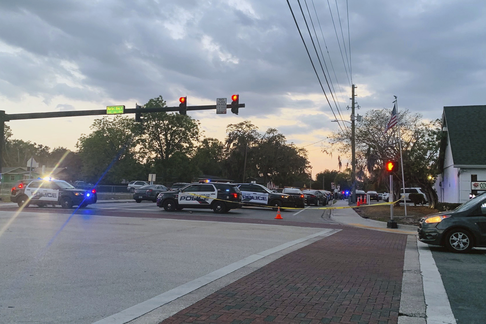 Police units block off 10th Street at Martin Luther King Jr. Avenue on Wednesday after a shooting that wounded a Lakeland officer and a juvenile. 