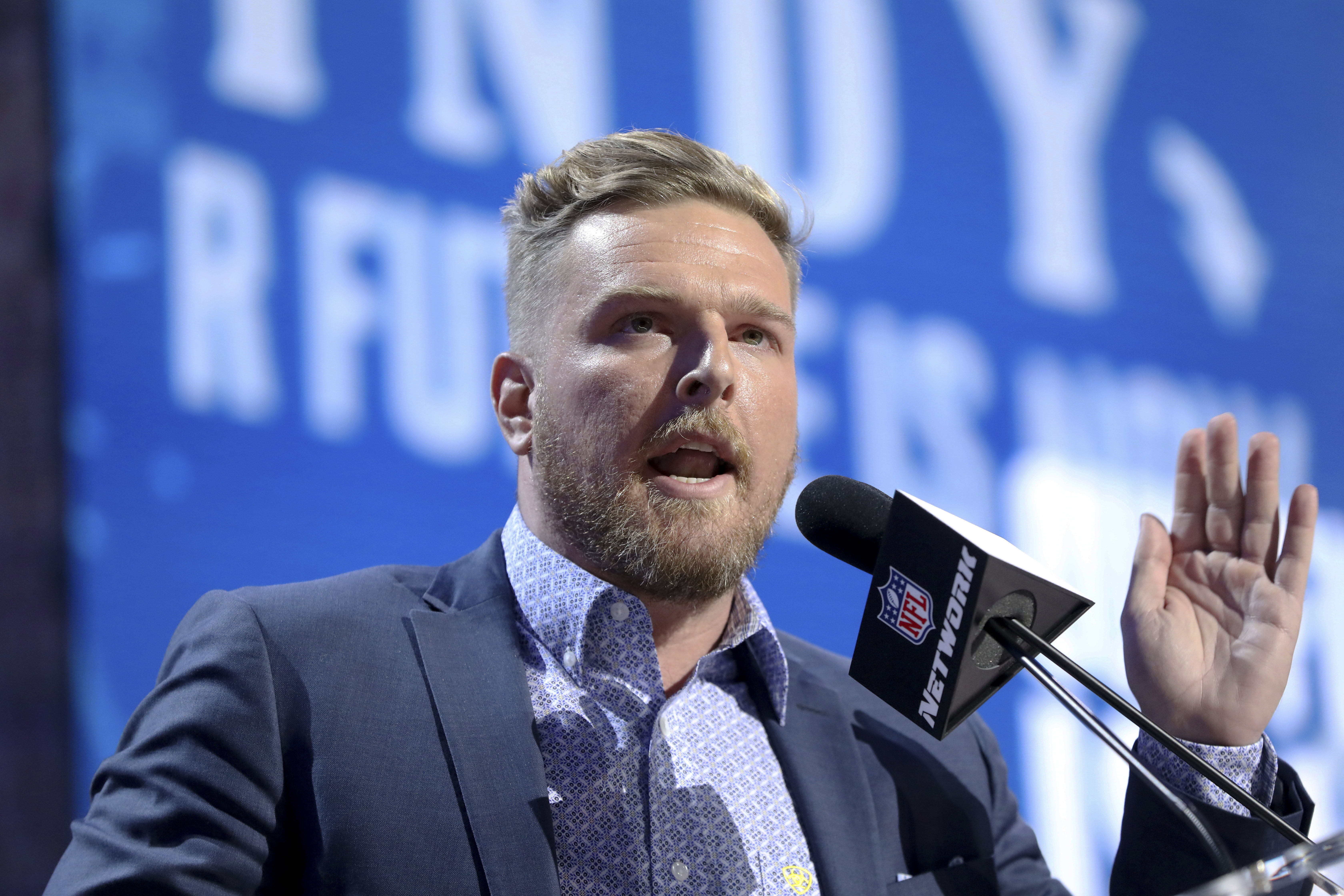 FILE - Former Indianapolis Colts player Pat McAfee announces the Colts' third round pick at the NFL football draft, April 26, 2019, in Nashville, Tenn. Retired NFL quarterback Brett Favre is dismissing his lawsuit against McAfee after McAfee publicly apologized for his previous on-air statements that Favre had been “stealing from poor people in Mississippi” in a welfare misspending case. Favre and McAfee both announced the settlement Thursday, May 11, 2023. 