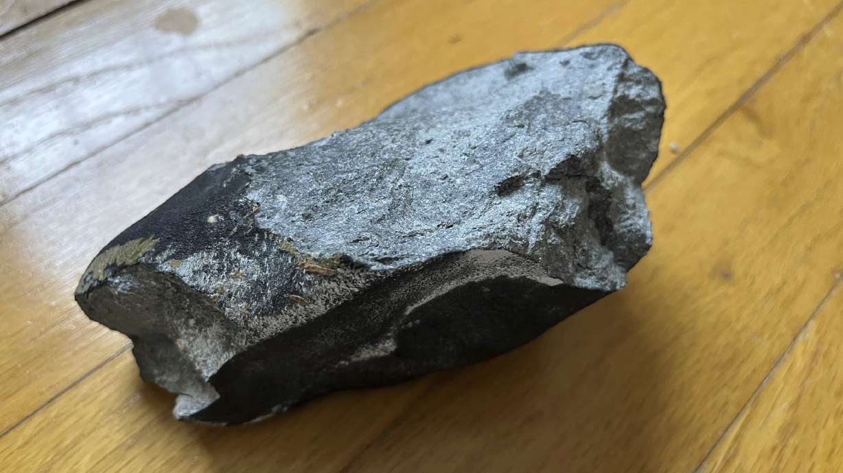 This image shows a confirmed meteorite on a hardwood floor at a residence in Hopewell Township, N.J. The meteorite punched a hole in the roof of the central New Jersey home.
